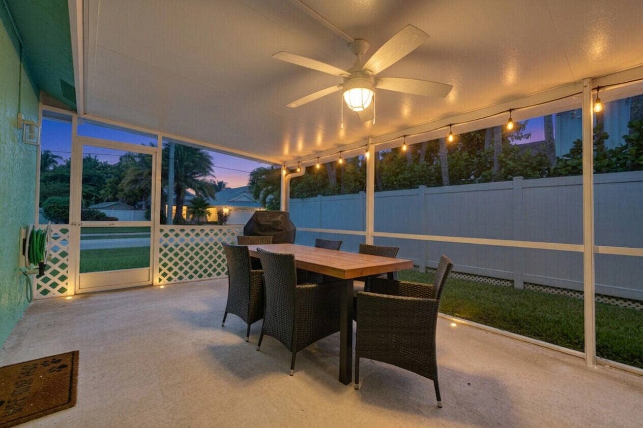6371 DANIA Street, Jupiter, FL 33458 Screened Back Patio at Twilight