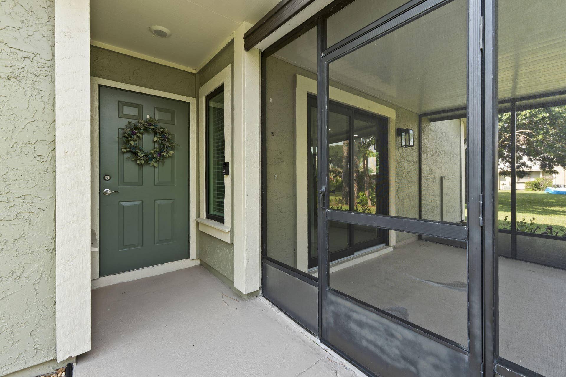 1431 SE COLCHESTER Circle, Port St Lucie, FL 34952 Front door/screened patio