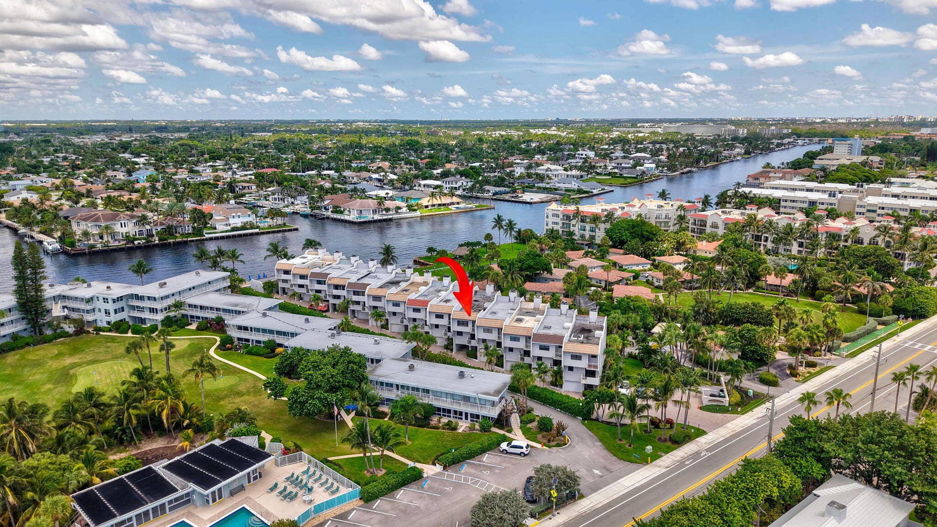 1222 Hillsboro Mile, #15, Hillsboro Beach, FL 33062 Waterfront property with multiple residential buildings, surrounded by mature landscaping and a well-maintained road