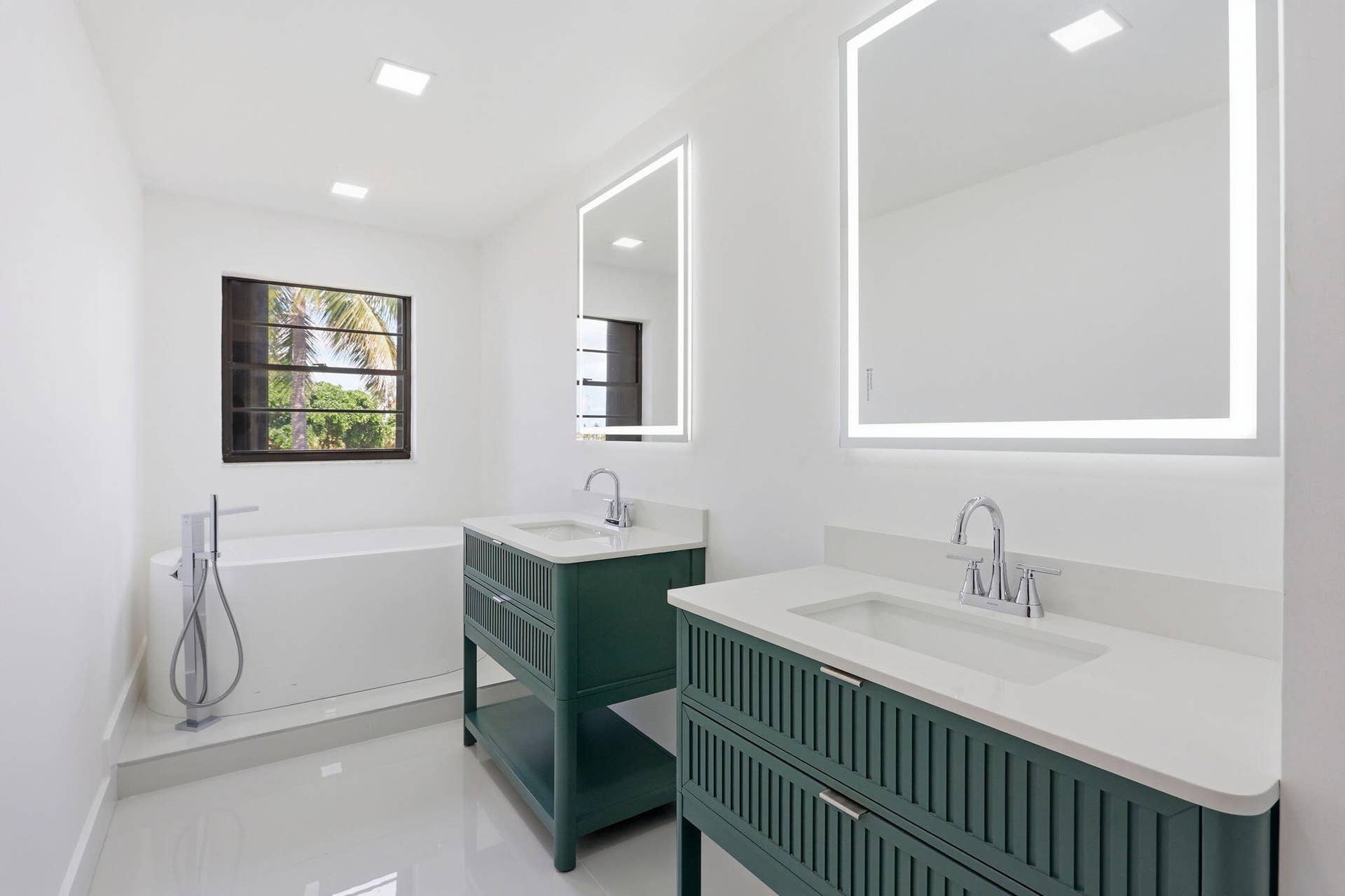 1222 Hillsboro Mile, #15, Hillsboro Beach, FL 33062 Dual green fluted vanities with integrated sinks, quartz countertops, and lighted mirrors