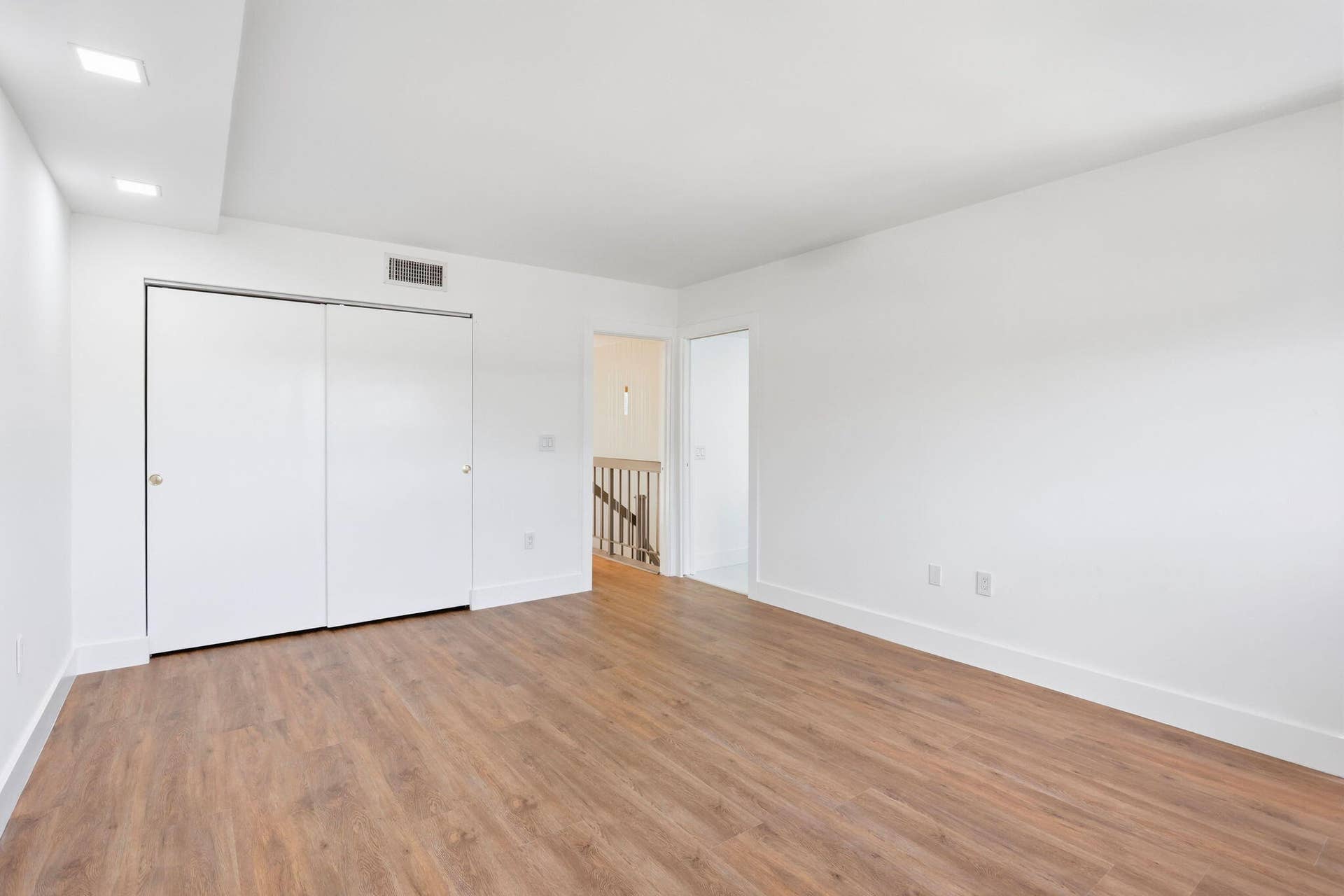 1222 Hillsboro Mile, #15, Hillsboro Beach, FL 33062 Spacious interior with wood-finish flooring, recessed lighting, and white walls