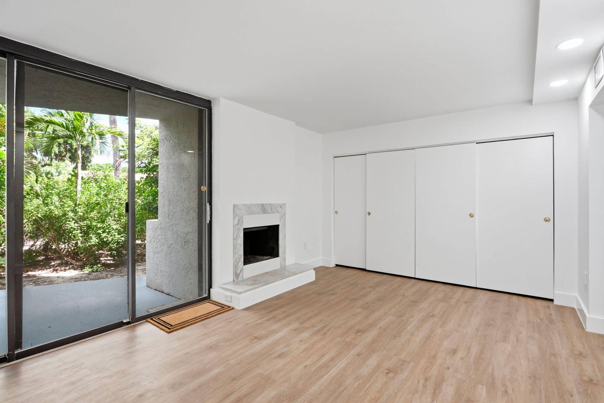 1222 Hillsboro Mile, #15, Hillsboro Beach, FL 33062 Wood-finish flooring, sliding glass patio door, marble-surround fireplace,
