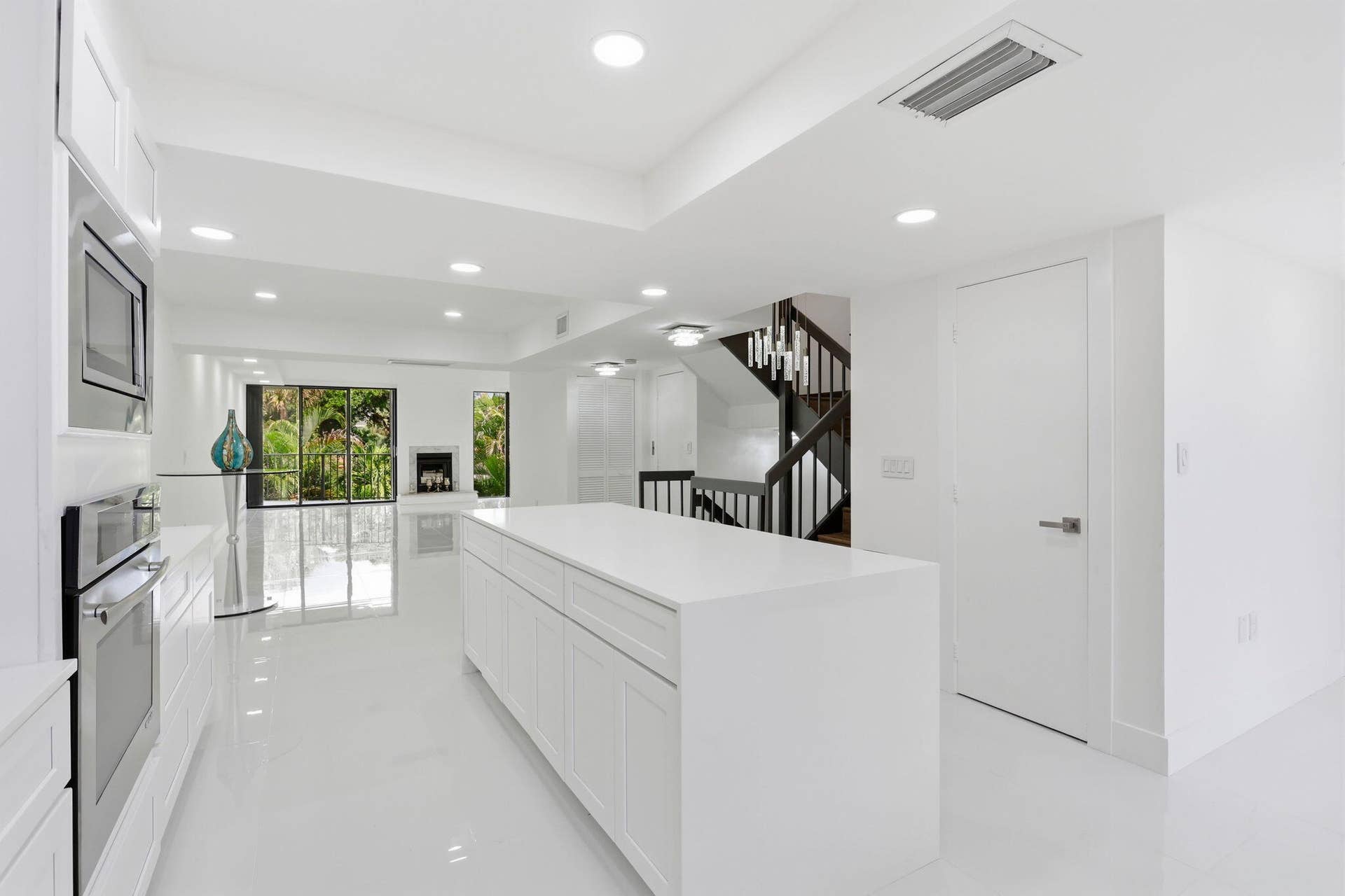 1222 Hillsboro Mile, #15, Hillsboro Beach, FL 33062 Open-concept kitchen with a large island, integrated stainless steel appliances, recessed ceiling lighting, and hard-surface flooring