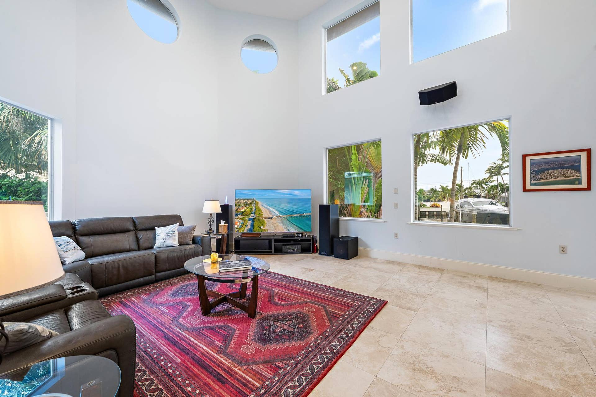 Soaring ceilings with upper-level rectangular and circular windows