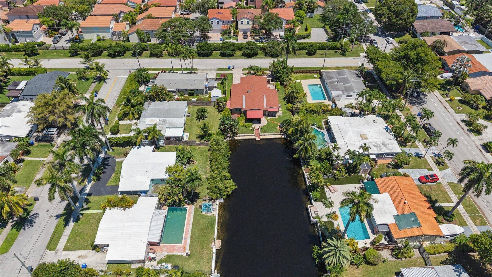 1158 Grant Street, Hollywood, FL 33019 View of home, canal and neighboring wate