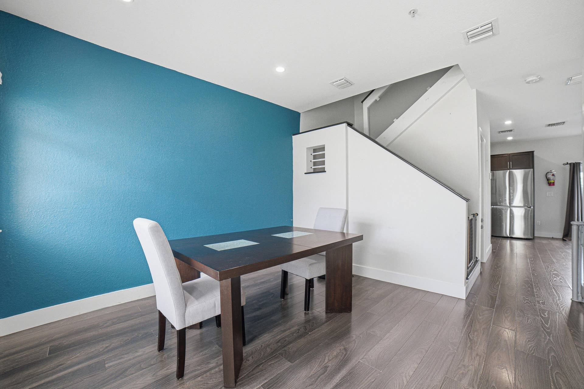 View from from door to Dining Room, Staircase and Kitchen.
