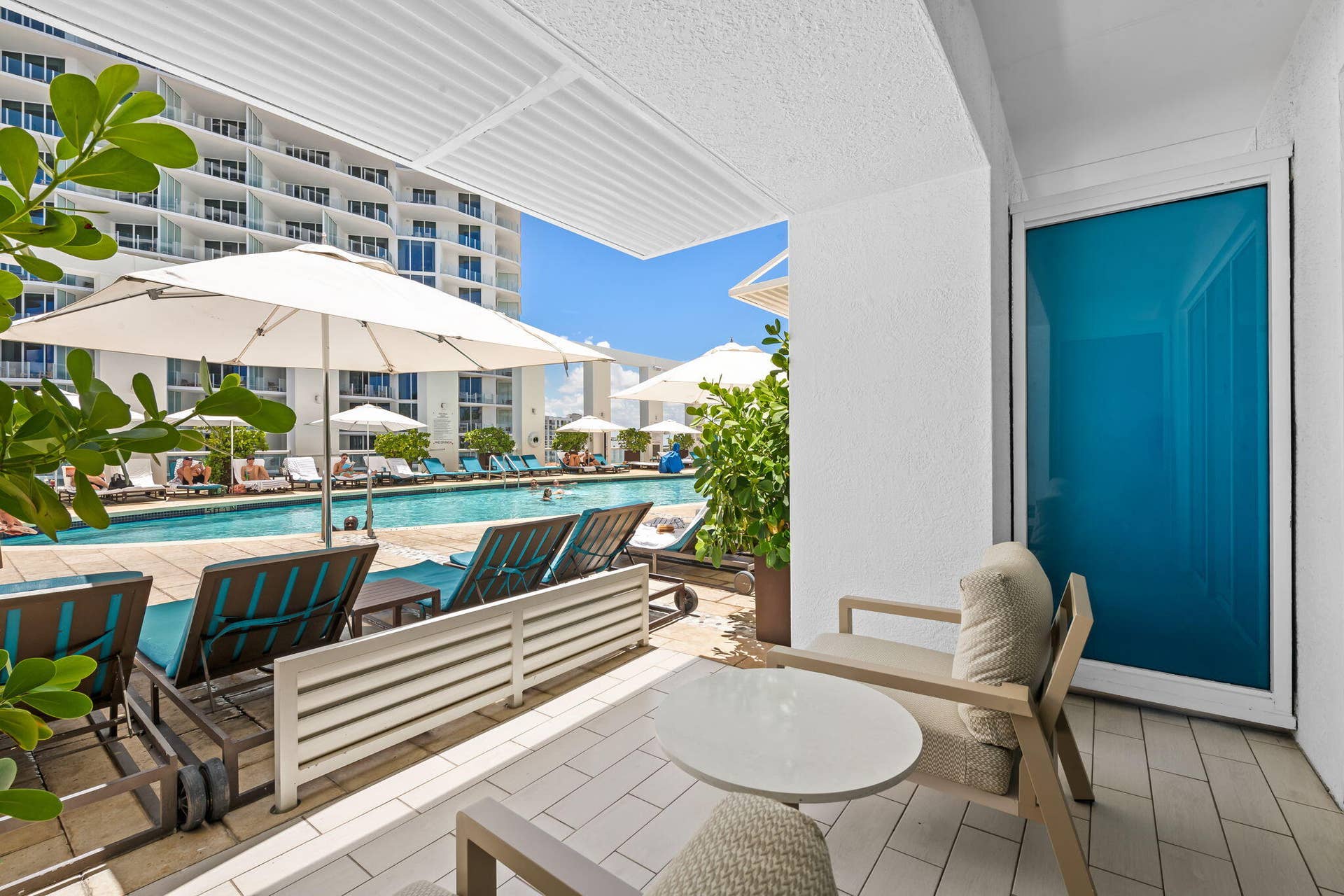Covered patio with tile flooring and direct access to a swimming pool