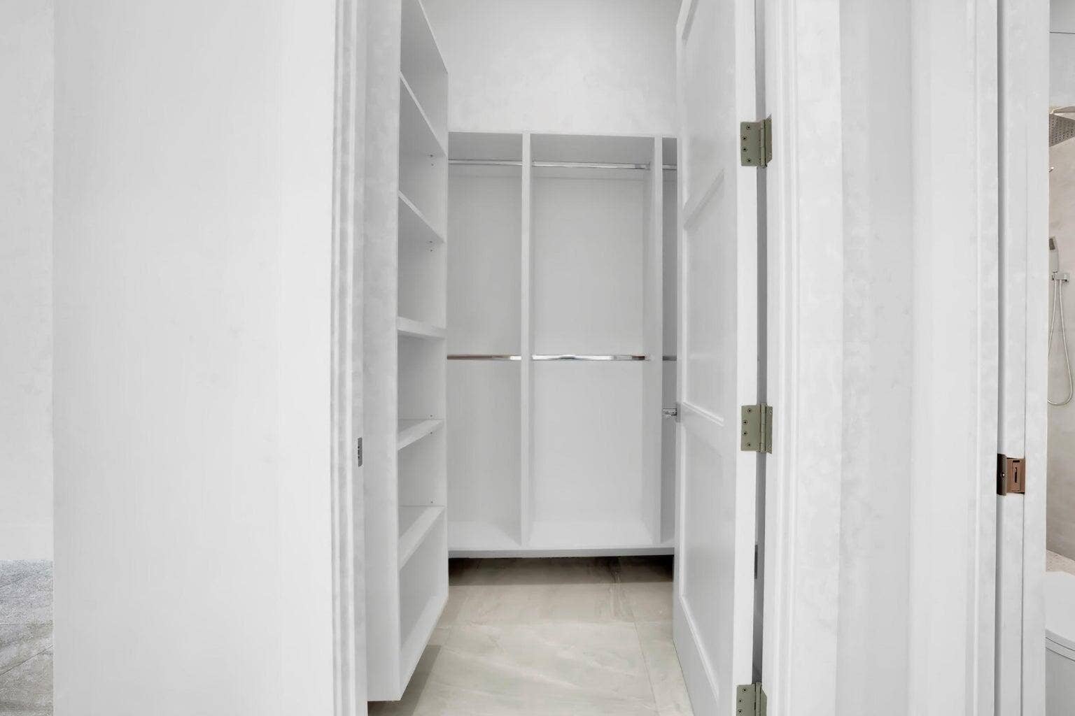 2517 Oceanview Avenue E, Delray Beach, Delray Beach, FL 33444 Built-in closet system with multiple shelving units and hanging rods