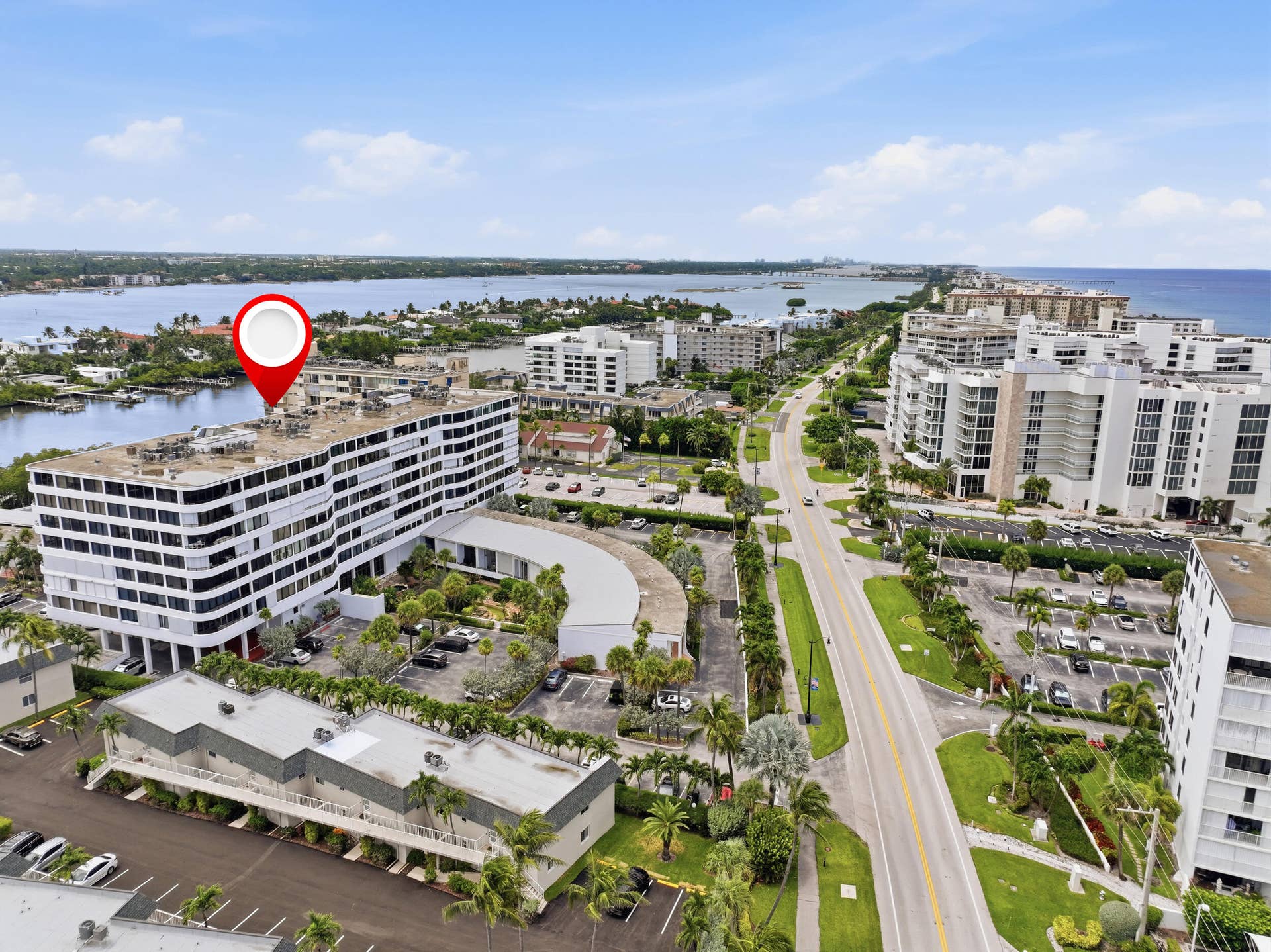 3589 S Ocean Boulevard, #808, South Palm Beach, FL 33480 Multi-story building featuring numerous windowed units