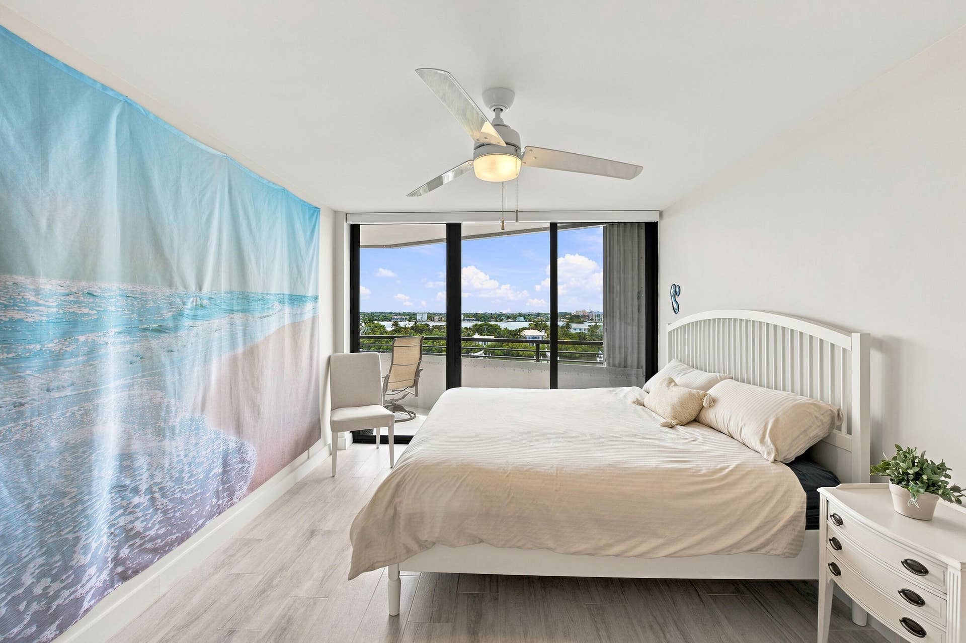 3589 S Ocean Boulevard, #808, South Palm Beach, FL 33480 Light-toned wood-finish flooring complements white walls and ceiling