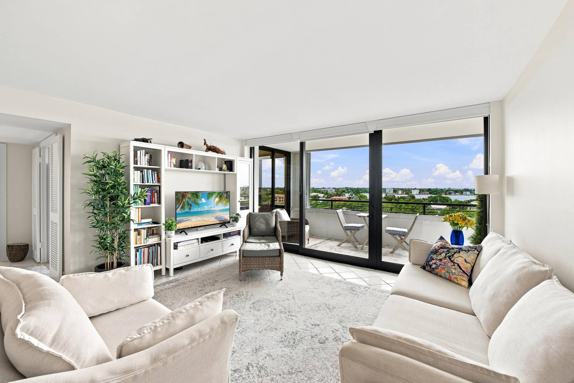 3589 S Ocean Boulevard, #808, South Palm Beach, FL 33480 Living area with expansive glass sliding doors opening to a private balcony