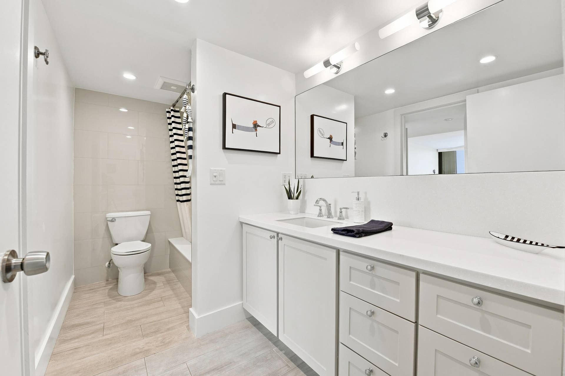 3589 S Ocean Boulevard, #808, South Palm Beach, FL 33480 Bathroom featuring a single vanity with ample counter space, white cabinetry, a built-in shower/tub combination, and neutral-toned tile flooring