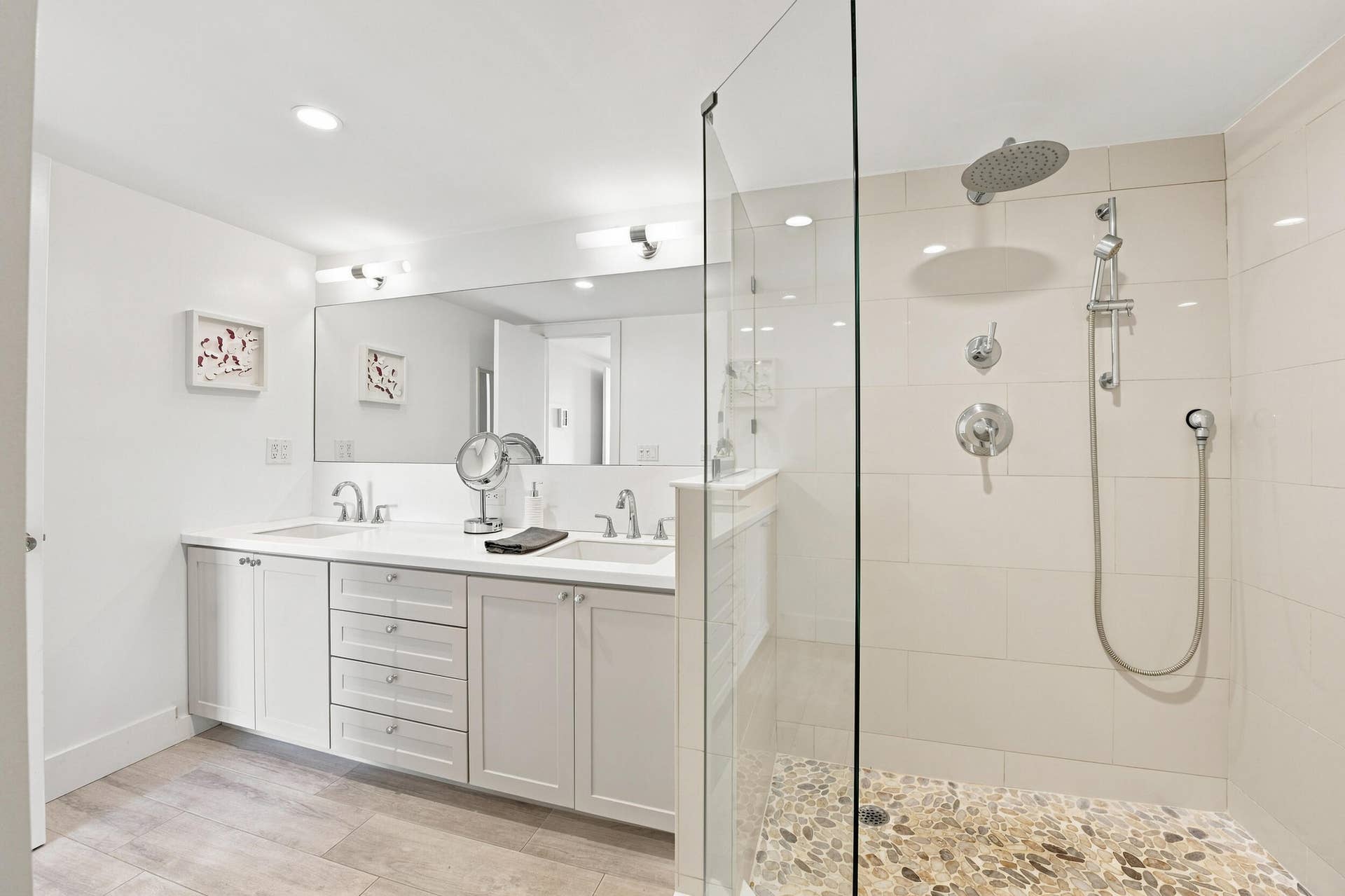 3589 S Ocean Boulevard, #808, South Palm Beach, FL 33480 Spacious walk-in shower with a pebble floor and rainfall showerhead