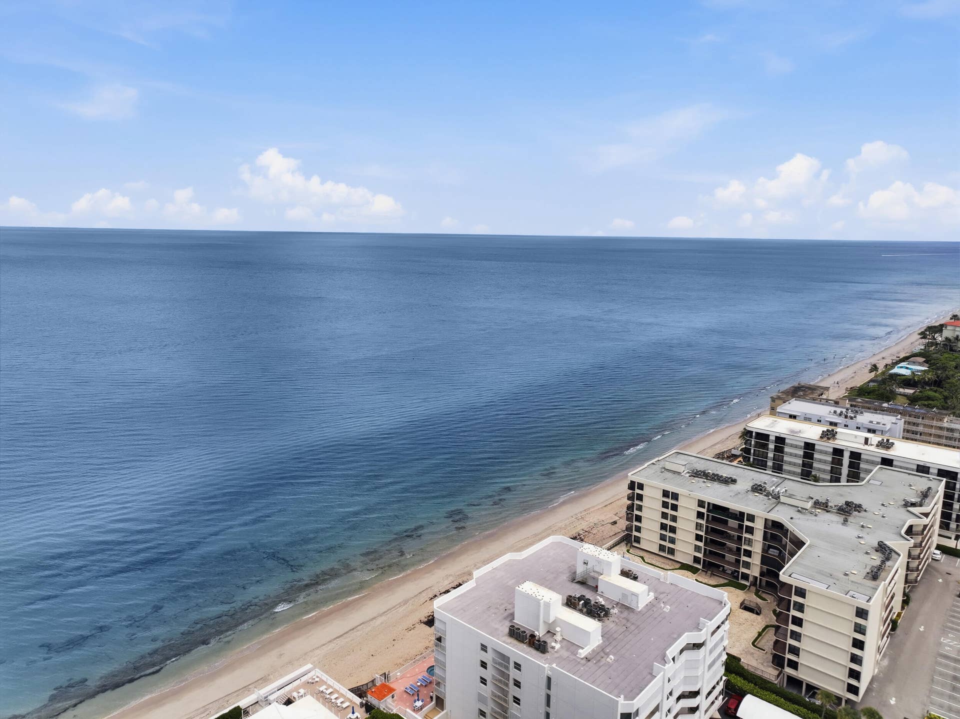 3589 S Ocean Boulevard, #808, South Palm Beach, FL 33480 Oceanfront views featuring sandy beaches and coastal buildings