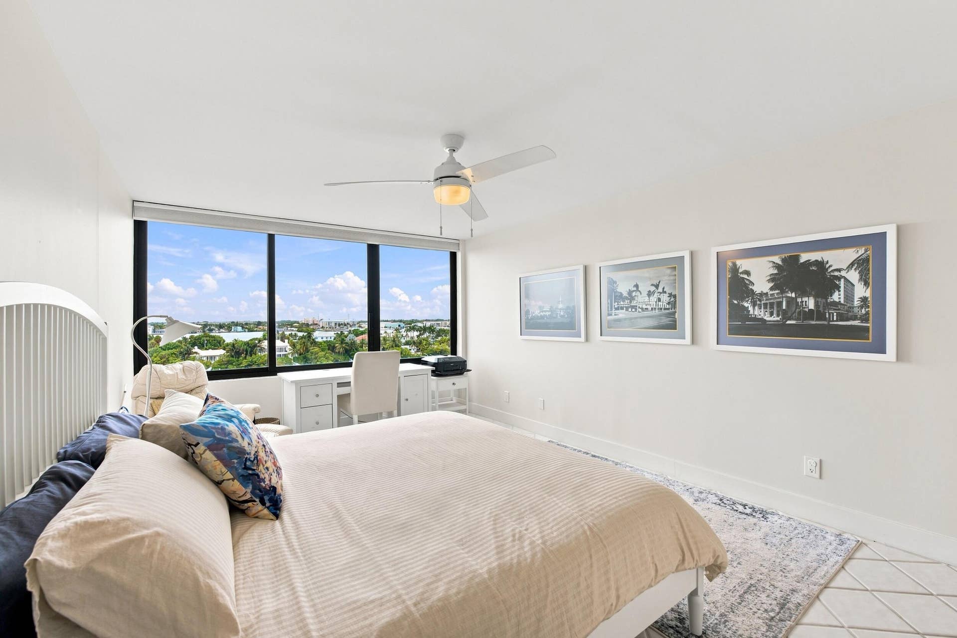 3589 S Ocean Boulevard, #808, South Palm Beach, FL 33480 Spacious room featuring floor-to-ceiling windows, a ceiling fan with integrated lighting, and tile flooring