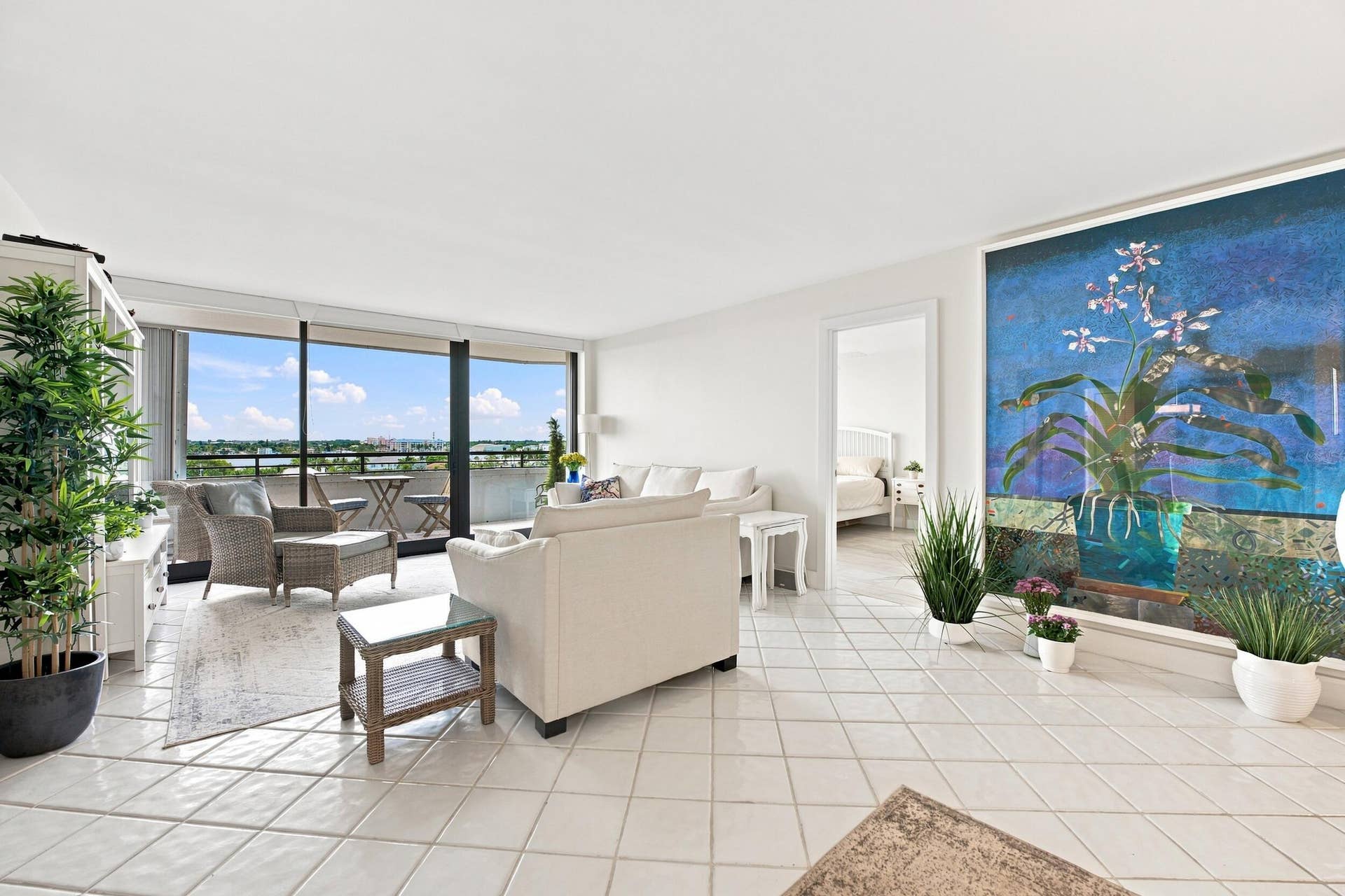 3589 S Ocean Boulevard, #808, South Palm Beach, FL 33480 Expansive living area featuring light-toned tile flooring throughout