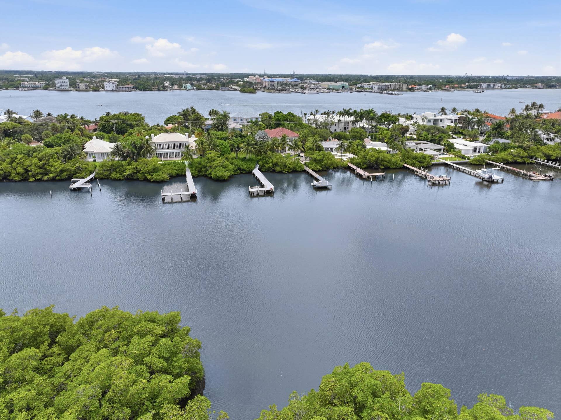 3589 S Ocean Boulevard, #808, South Palm Beach, FL 33480 Waterfront properties featuring private docks and mature tropical landscaping
