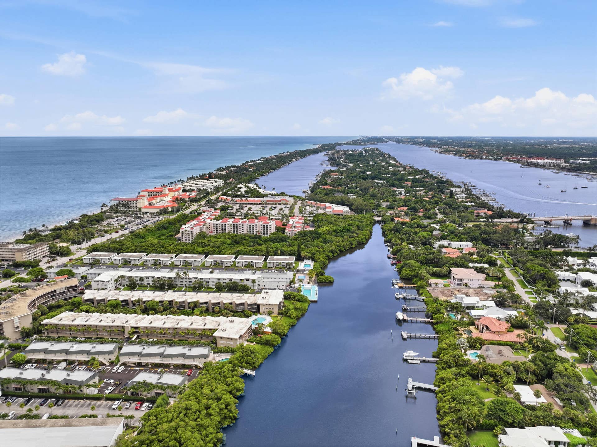 3589 S Ocean Boulevard, #808, South Palm Beach, FL 33480 Aerial perspective showcasing waterfront properties along a canal and expansive oceanfront