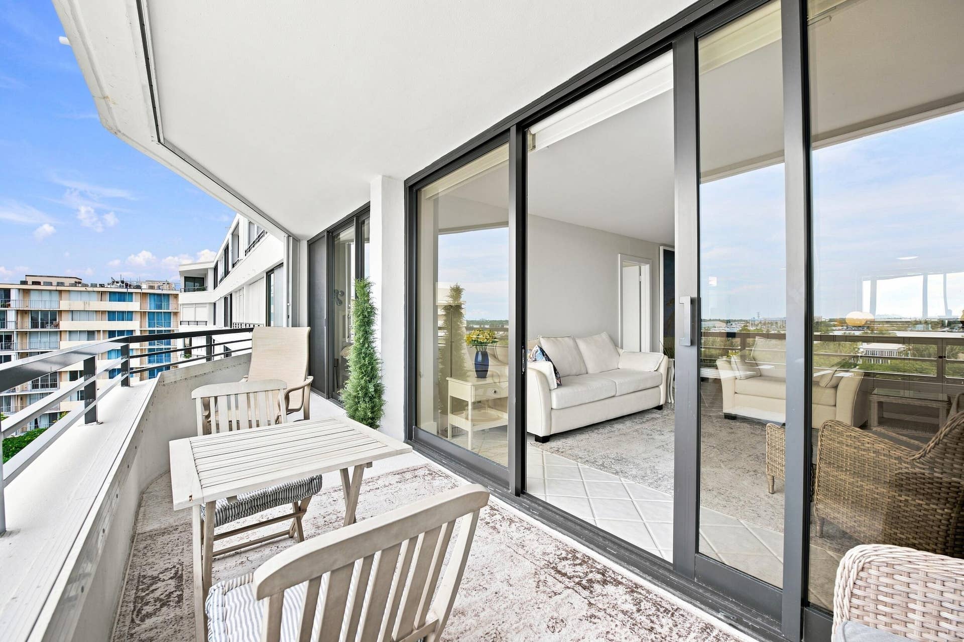 3589 S Ocean Boulevard, #808, South Palm Beach, FL 33480 Expansive balcony featuring black metal railings and a textured floor surface