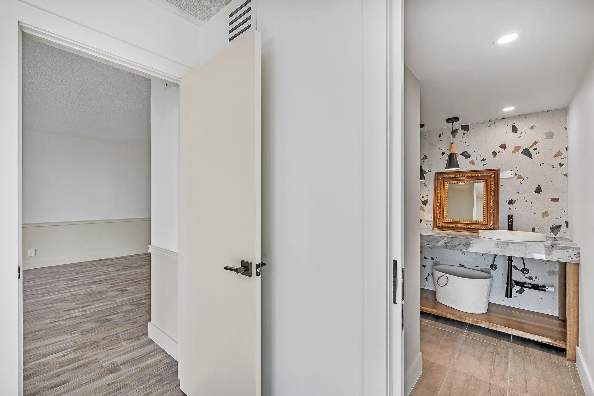 3051 NE 48TH Street, #301, Fort Lauderdale, Fort Lauderdale, FL 33308 Hallway with wood-finish flooring and a white paneled door