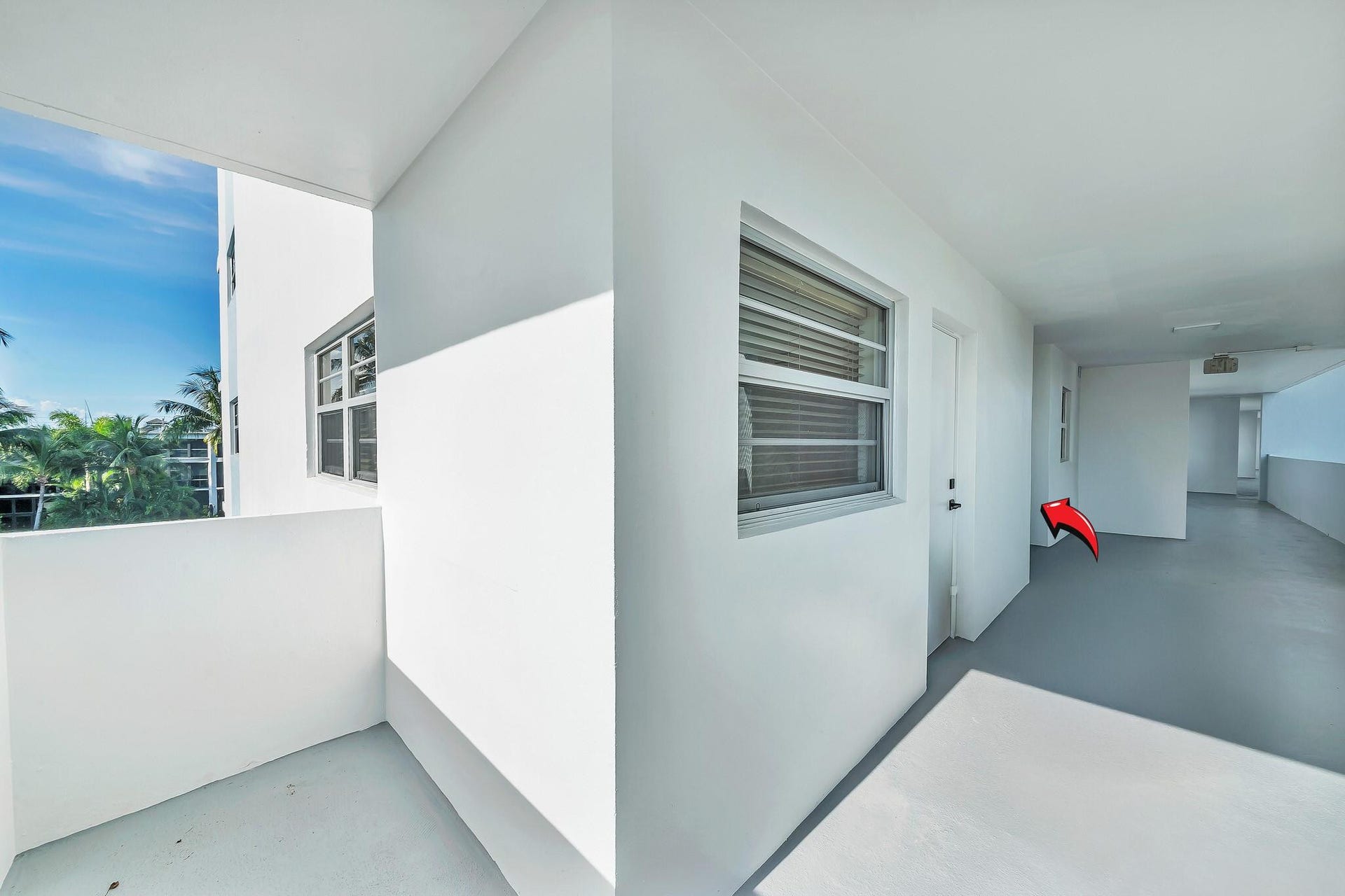 3051 NE 48TH Street, #301, Fort Lauderdale, Fort Lauderdale, FL 33308 White exterior walls with multiple windows and a balcony