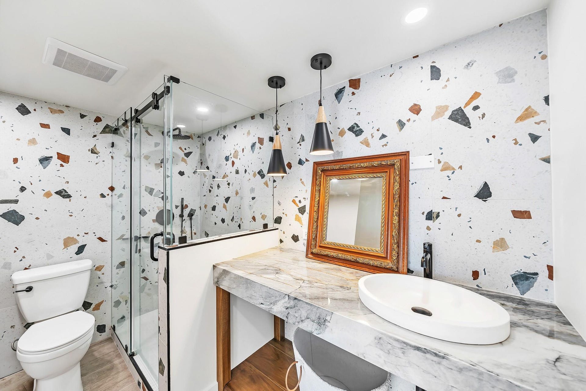 3051 NE 48TH Street, #301, Fort Lauderdale, Fort Lauderdale, FL 33308 Glass-enclosed shower with matte black fixtures, a white vessel sink, and a marbled countertop