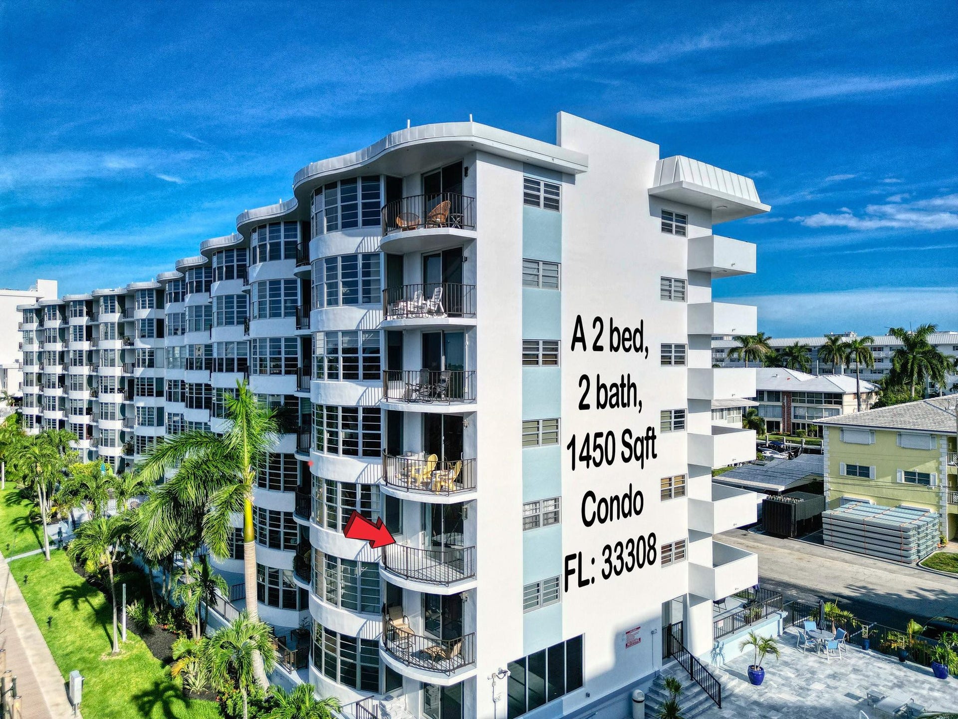 3051 NE 48TH Street, #301, Fort Lauderdale, Fort Lauderdale, FL 33308 Mid-rise residential building featuring multiple balconies, extensive window-lined facades, and mature palm trees
