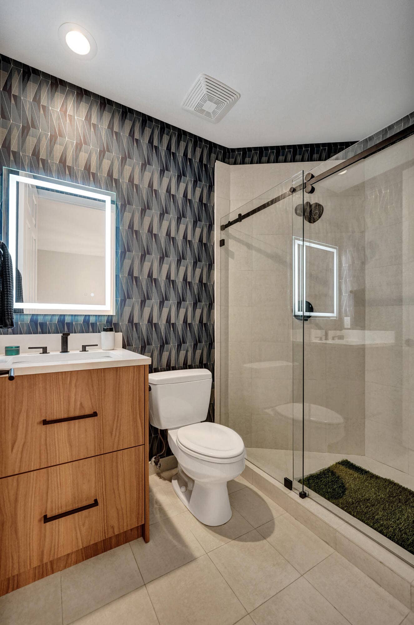 Wood-finish vanity with two drawers, white countertop, and rectangular undermount sink