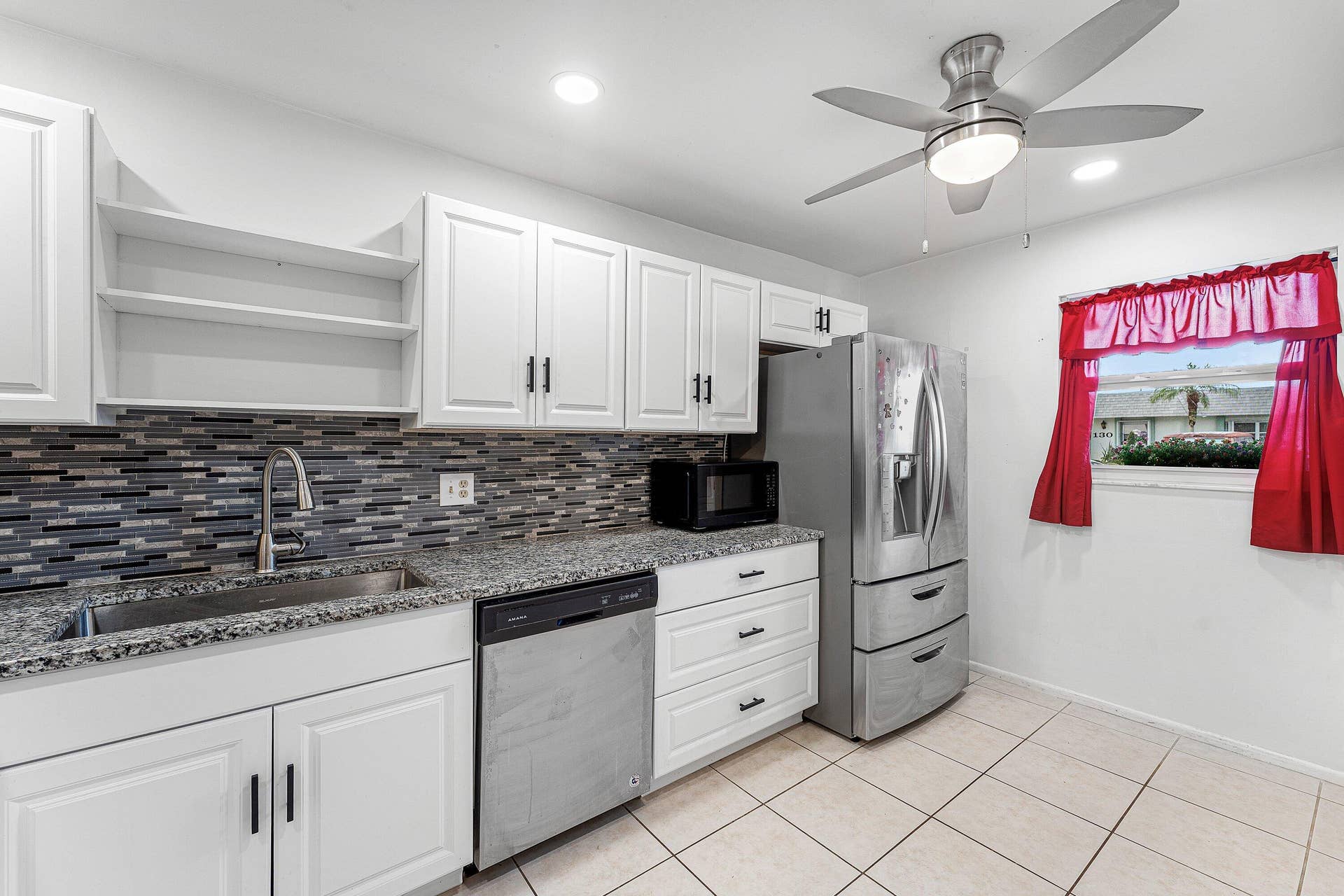 2638 GATELY Drive E, #125, West Palm Beach, FL 33415 Kitchen window lots of cabinets