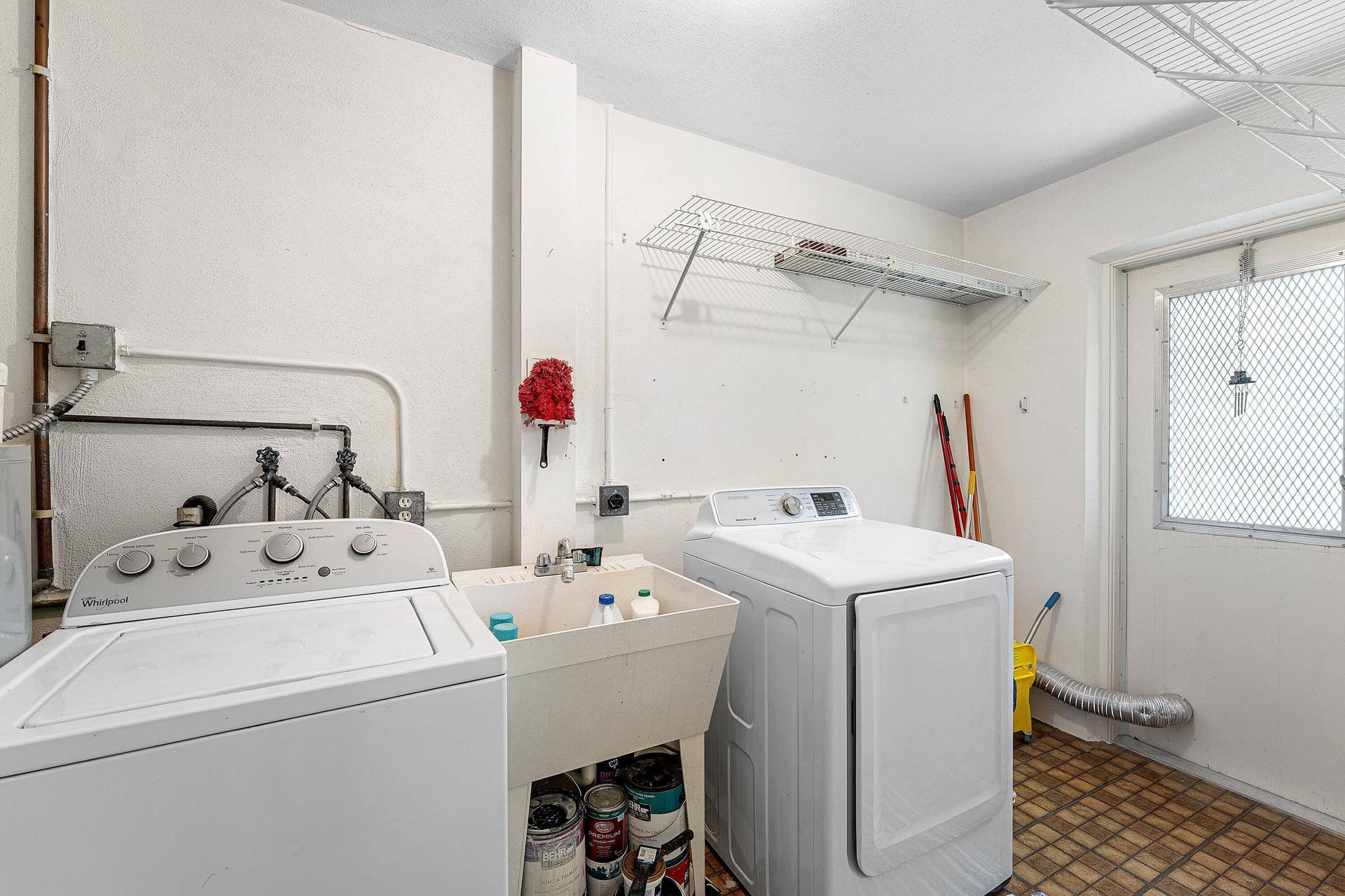 2638 GATELY Drive E, #125, West Palm Beach, FL 33415 with sink and exit door