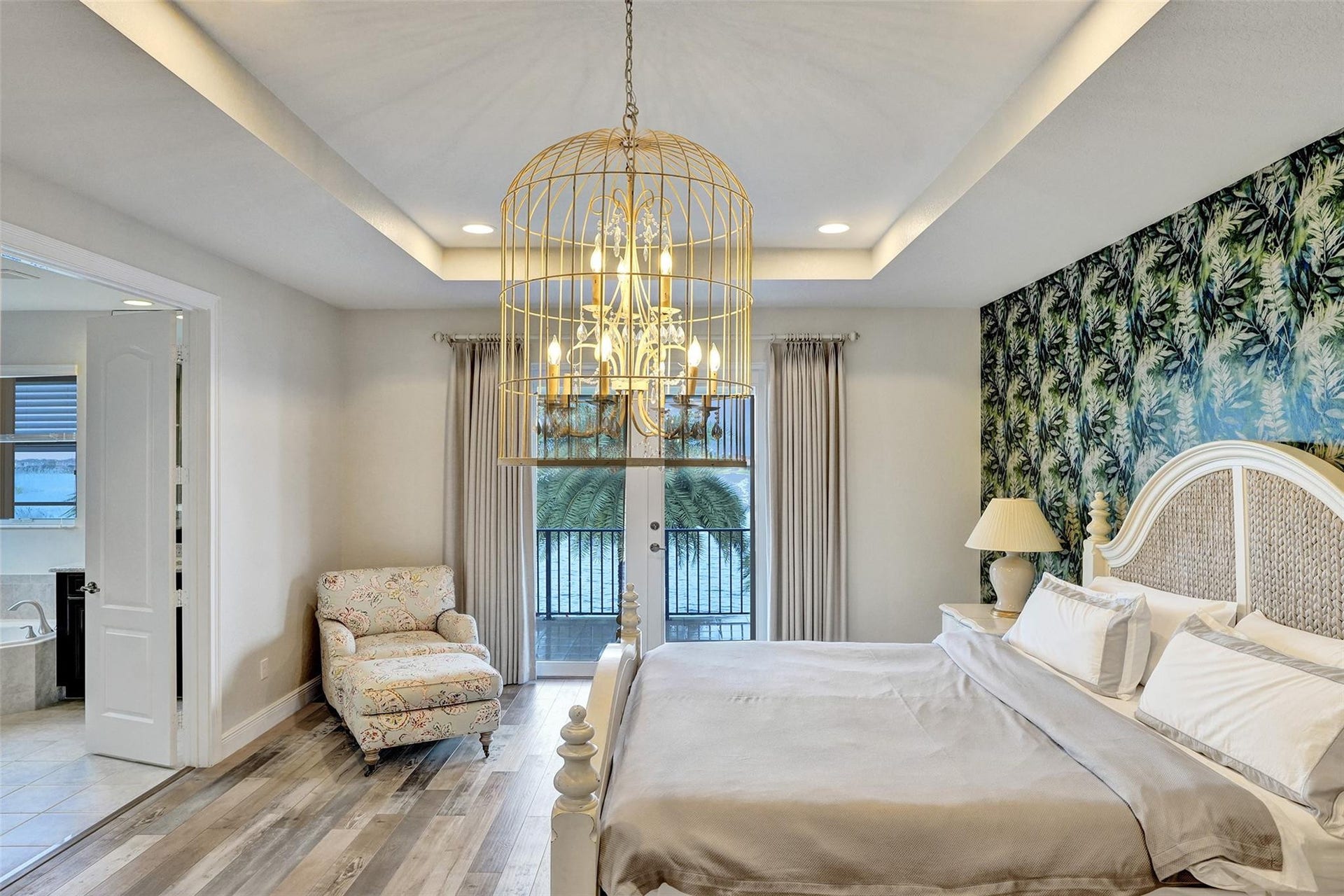 9749 Blue Isle, #BAY, Parkland, FL 33076 Tray ceiling with recessed lighting and a decorative chandelier