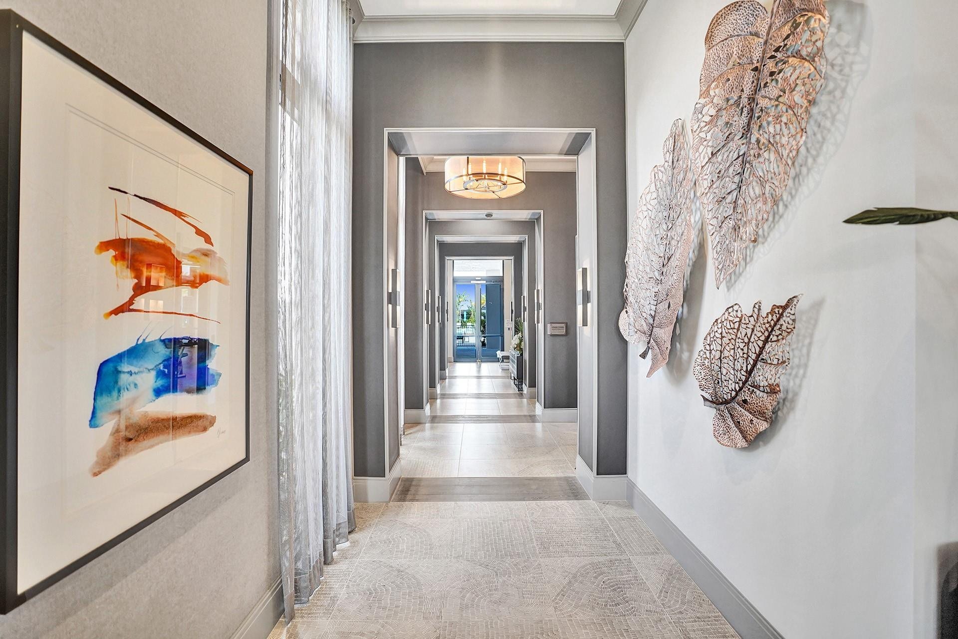 9749 Blue Isle, #BAY, Parkland, FL 33076 Long hallway featuring recessed lighting, a patterned floor runner, and wall sconces