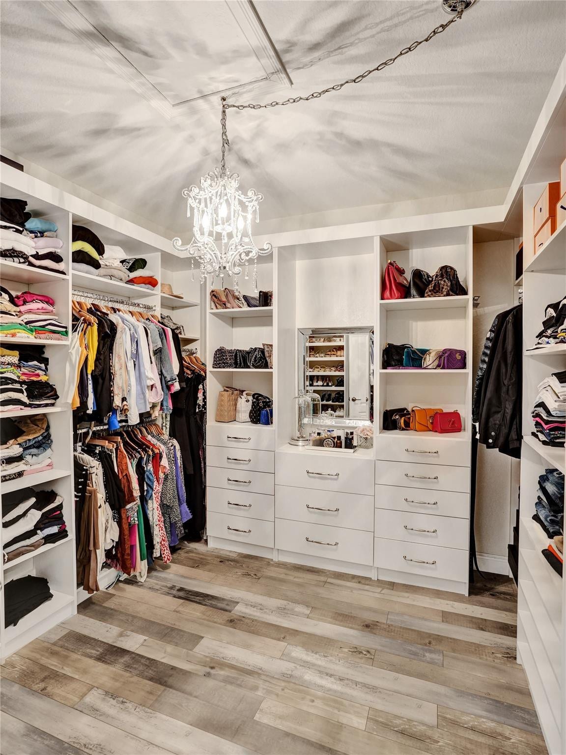 9749 Blue Isle, #BAY, Parkland, FL 33076 Custom closet system featuring built-in shelving, hanging rods, and drawers