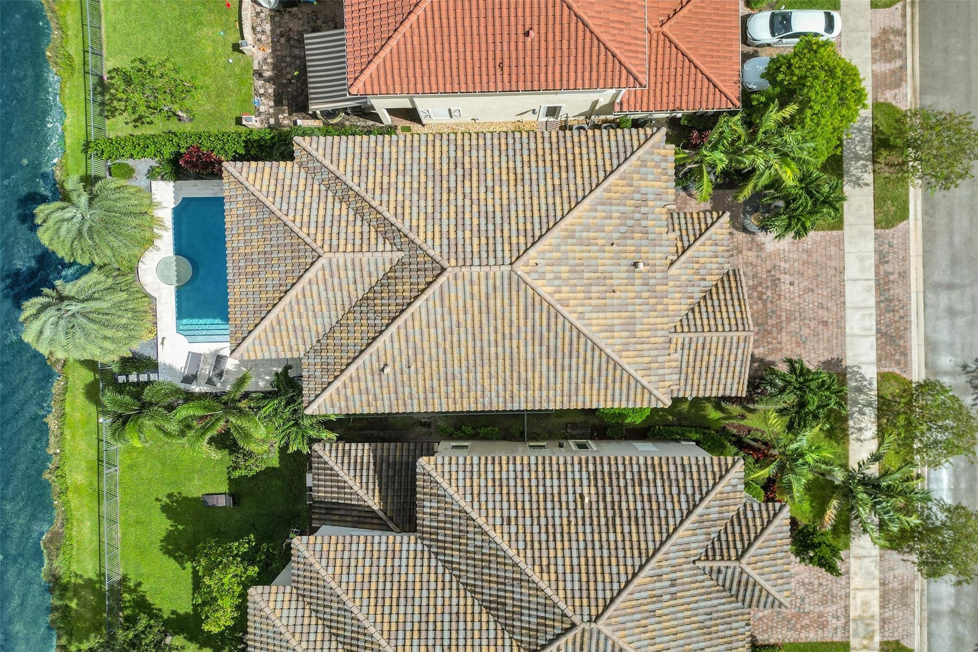 9749 Blue Isle, #BAY, Parkland, FL 33076 Tile roof, integrated swimming pool, spa, green lawn, paved driveway