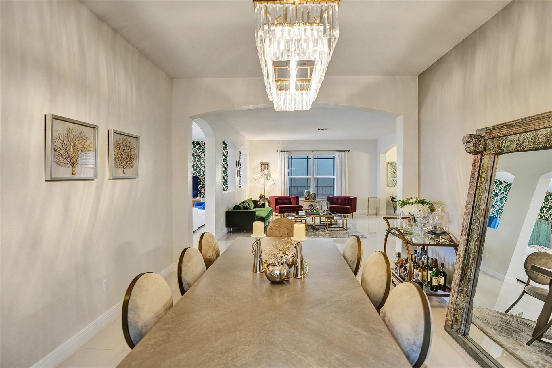 9749 Blue Isle, #BAY, Parkland, FL 33076 Recessed archways, a rectangular crystal chandelier, and tile flooring