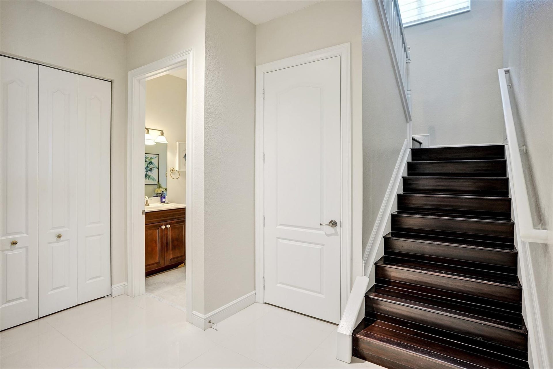 9749 Blue Isle, #BAY, Parkland, FL 33076 Dark wood-finish staircase with white risers and handrail