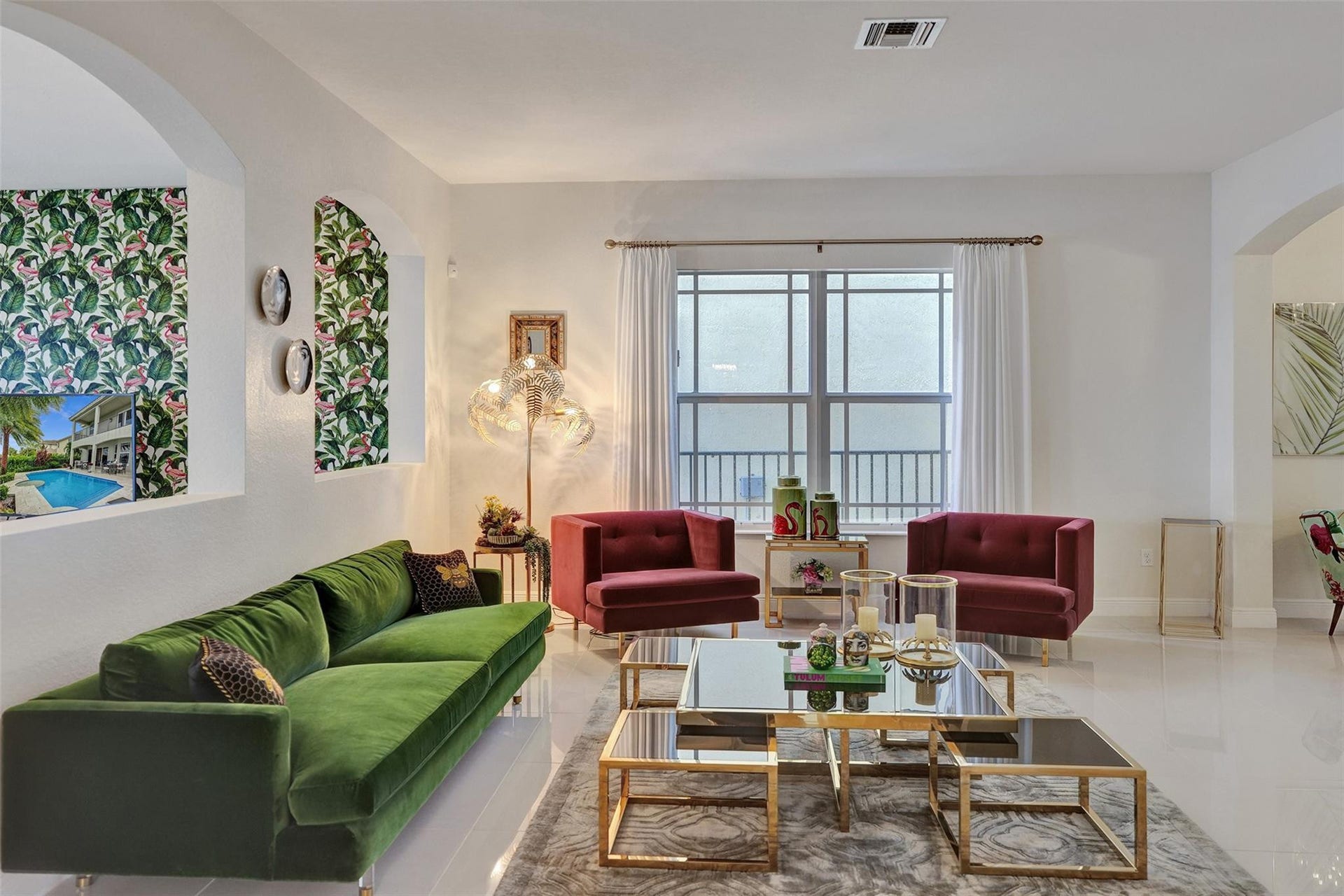 9749 Blue Isle, #BAY, Parkland, FL 33076 Recessed niches with decorative wall coverings, large multi-pane windows, arched doorways, and light-toned tile flooring