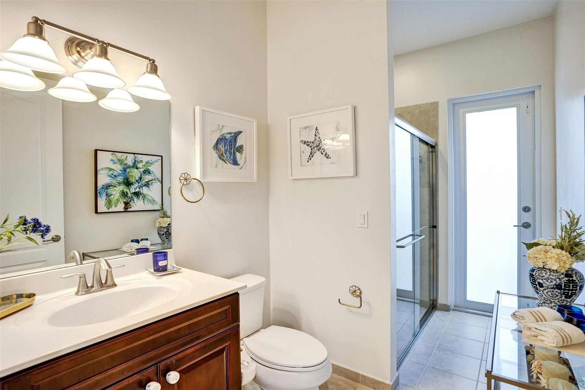 9749 Blue Isle, #BAY, Parkland, FL 33076 White vanity with integrated sink, brushed nickel faucet, and wood-finish cabinetry
