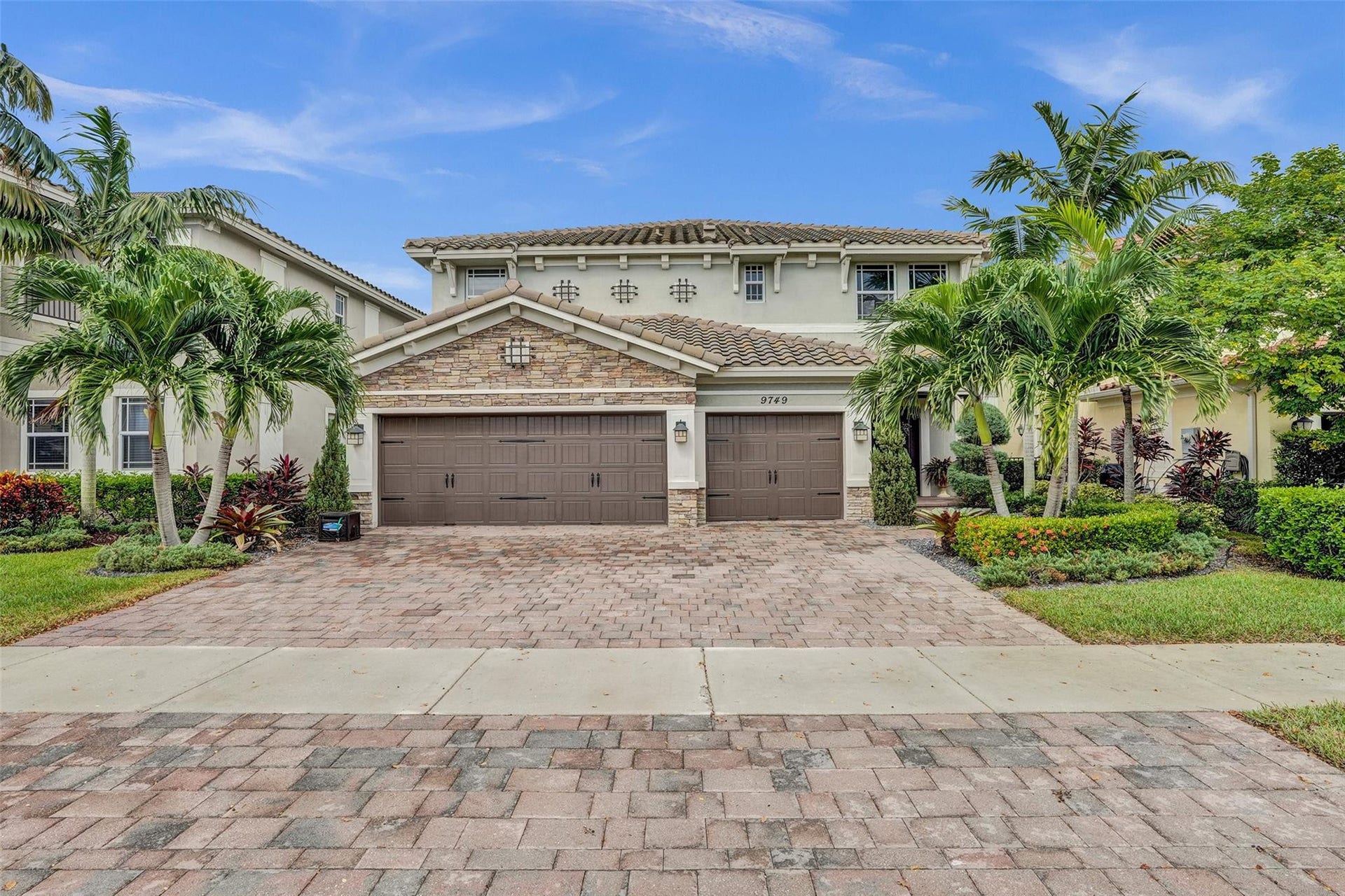 9749 Blue Isle, #BAY, Parkland, FL 33076 Two-story stucco exterior featuring a stone facade and tile roof