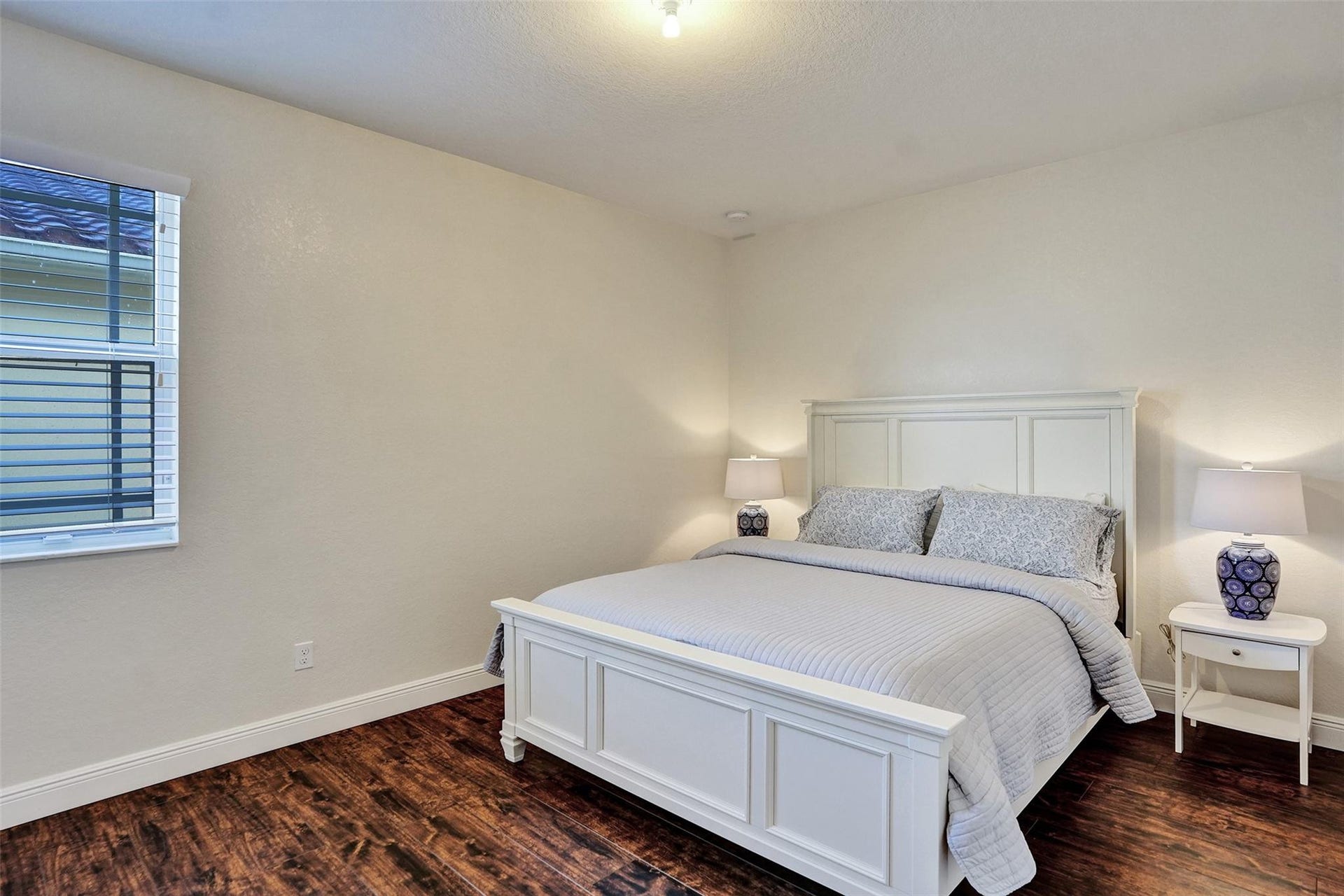 9749 Blue Isle, #BAY, Parkland, FL 33076 Wood-finish flooring, recessed lighting, and a window with blinds
