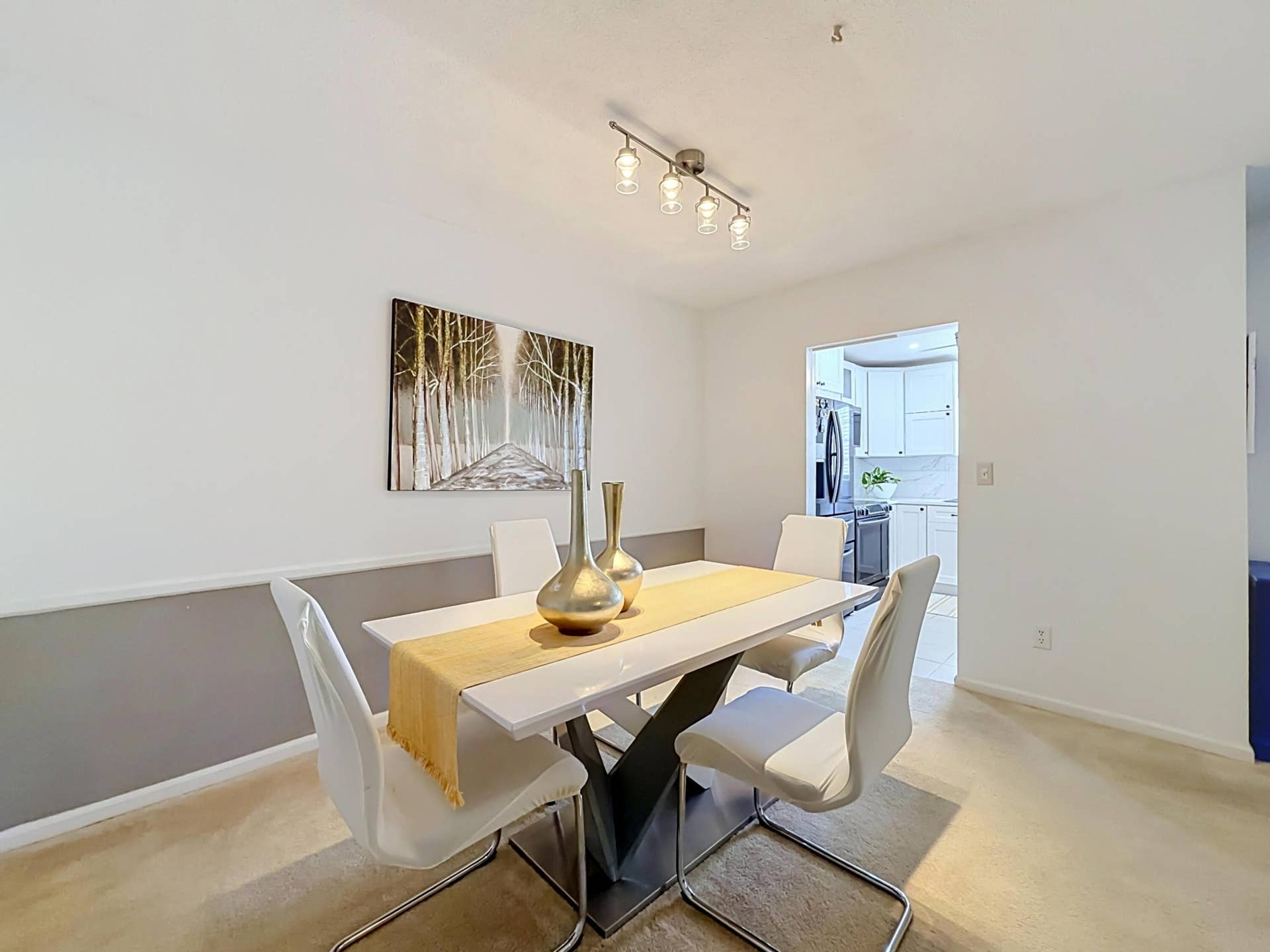Recessed lighting and track lighting fixtures illuminate the space