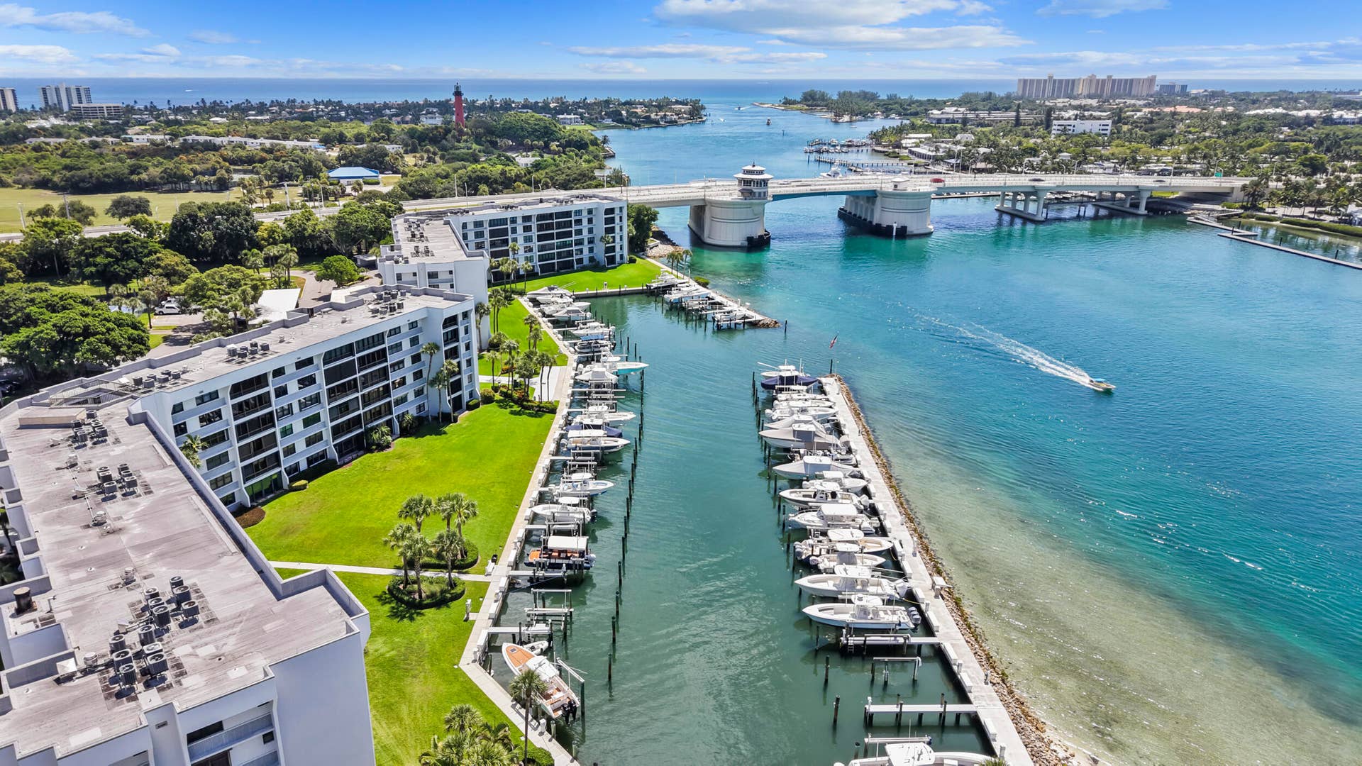 Waterfront property with private boat docks, multiple residential buildings, and direct water access