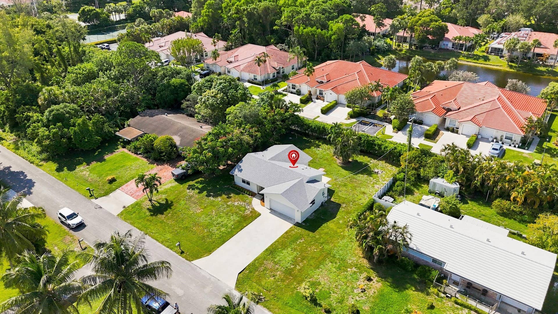 5114 Conklin Drive, Delray Beach, FL 33484 Elevated aerial view highlighting the property and its surrounding residential neighborhood.