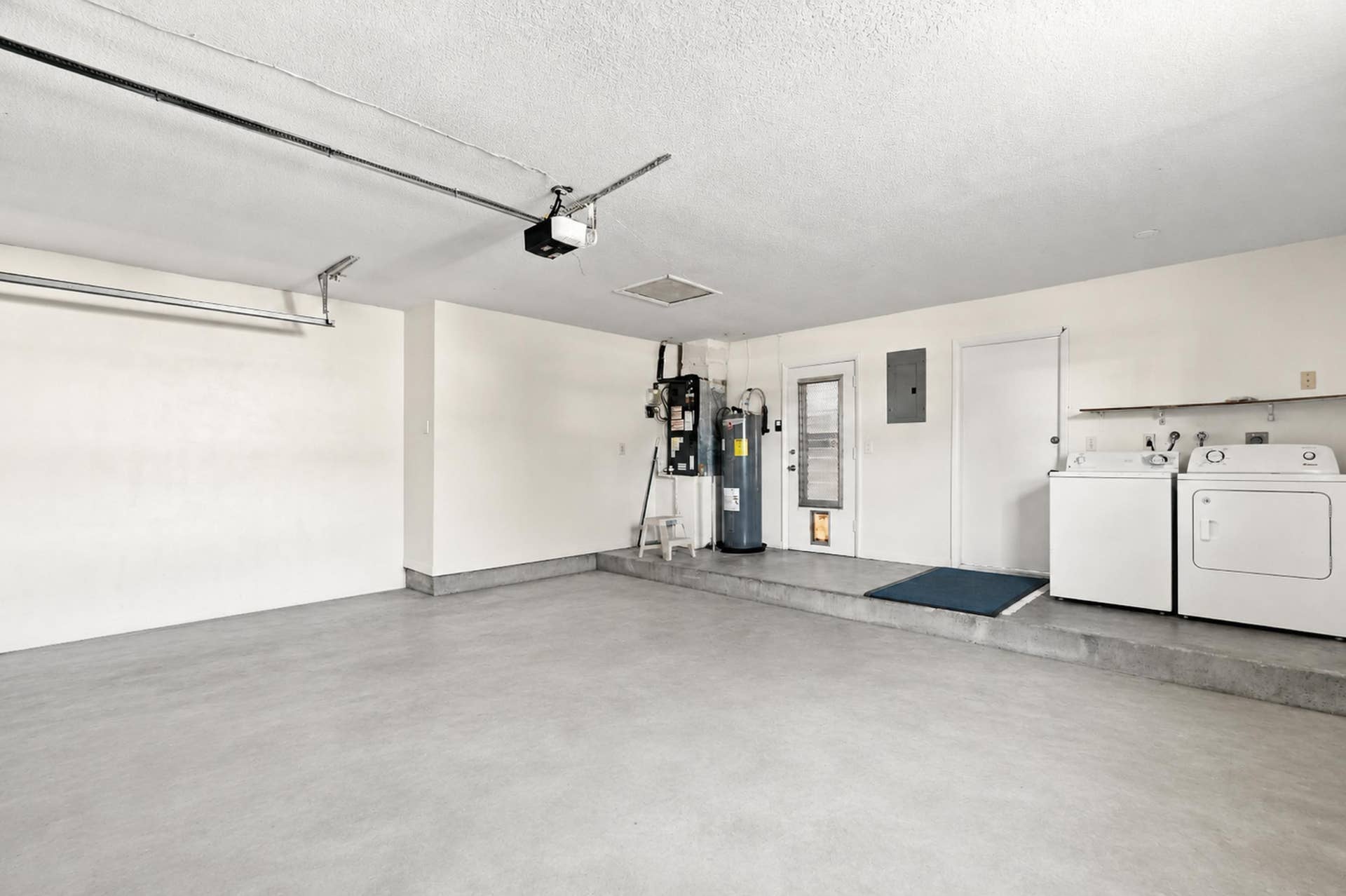 5114 Conklin Drive, Delray Beach, FL 33484 Spacious garage with utility area and room for parking and storage.