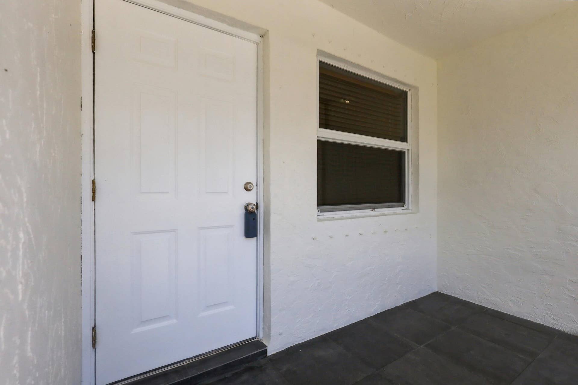 5114 Conklin Drive, Delray Beach, FL 33484 Covered front entry with convenient access into the home.