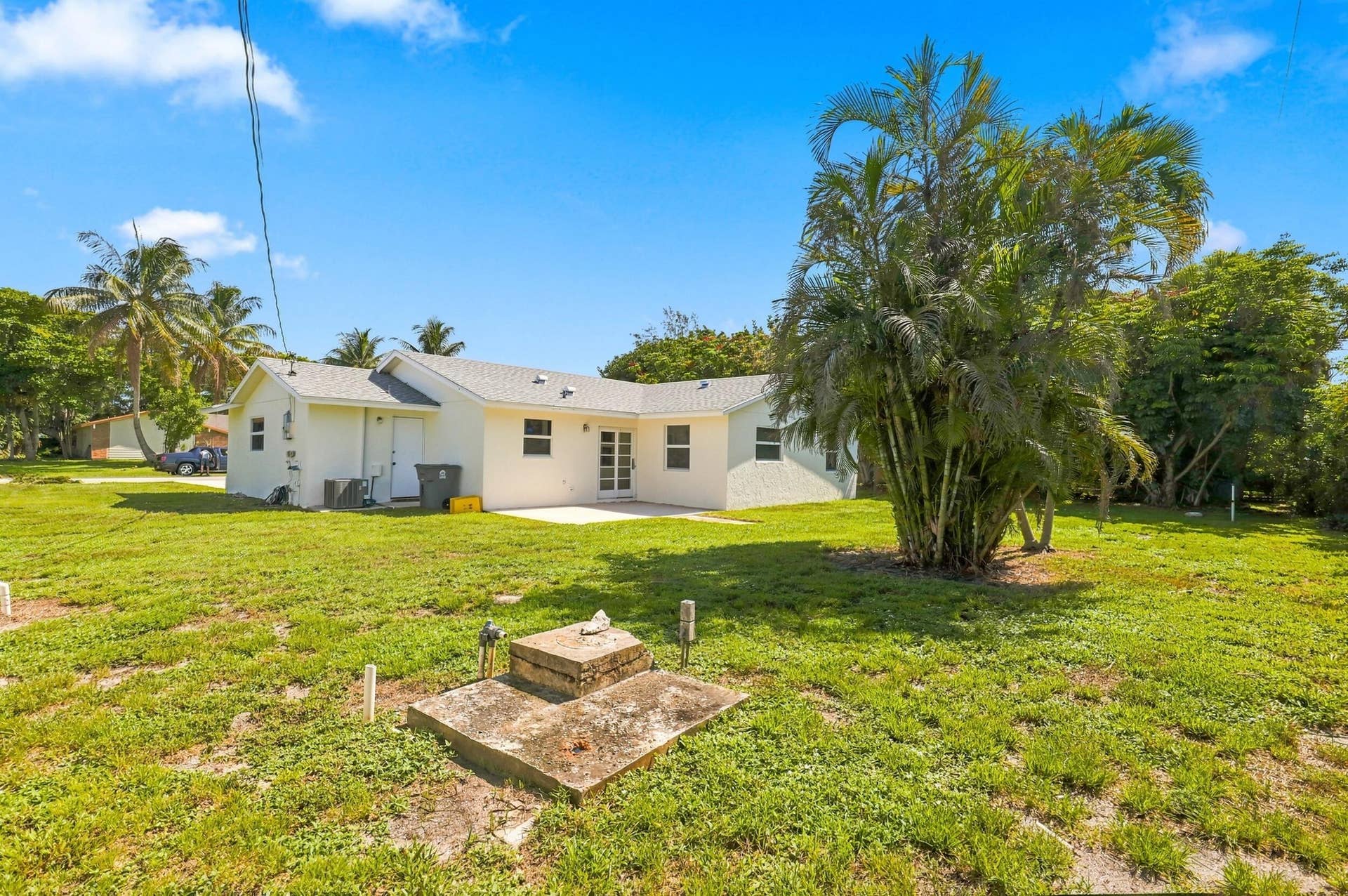 5114 Conklin Drive, Delray Beach, FL 33484 Generous grassy backyard offering plenty of outdoor space and mature landscaping.