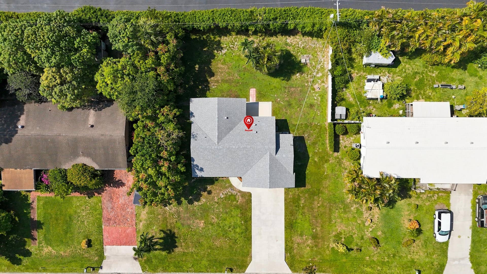 5114 Conklin Drive, Delray Beach, FL 33484 Overhead aerial view showcasing the home, lot, driveway, and surrounding properties.