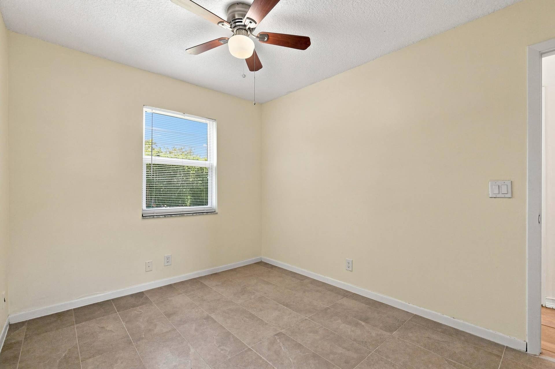 5114 Conklin Drive, Delray Beach, FL 33484 Comfortable bedroom featuring neutral finishes, ceiling fan, and natural light.