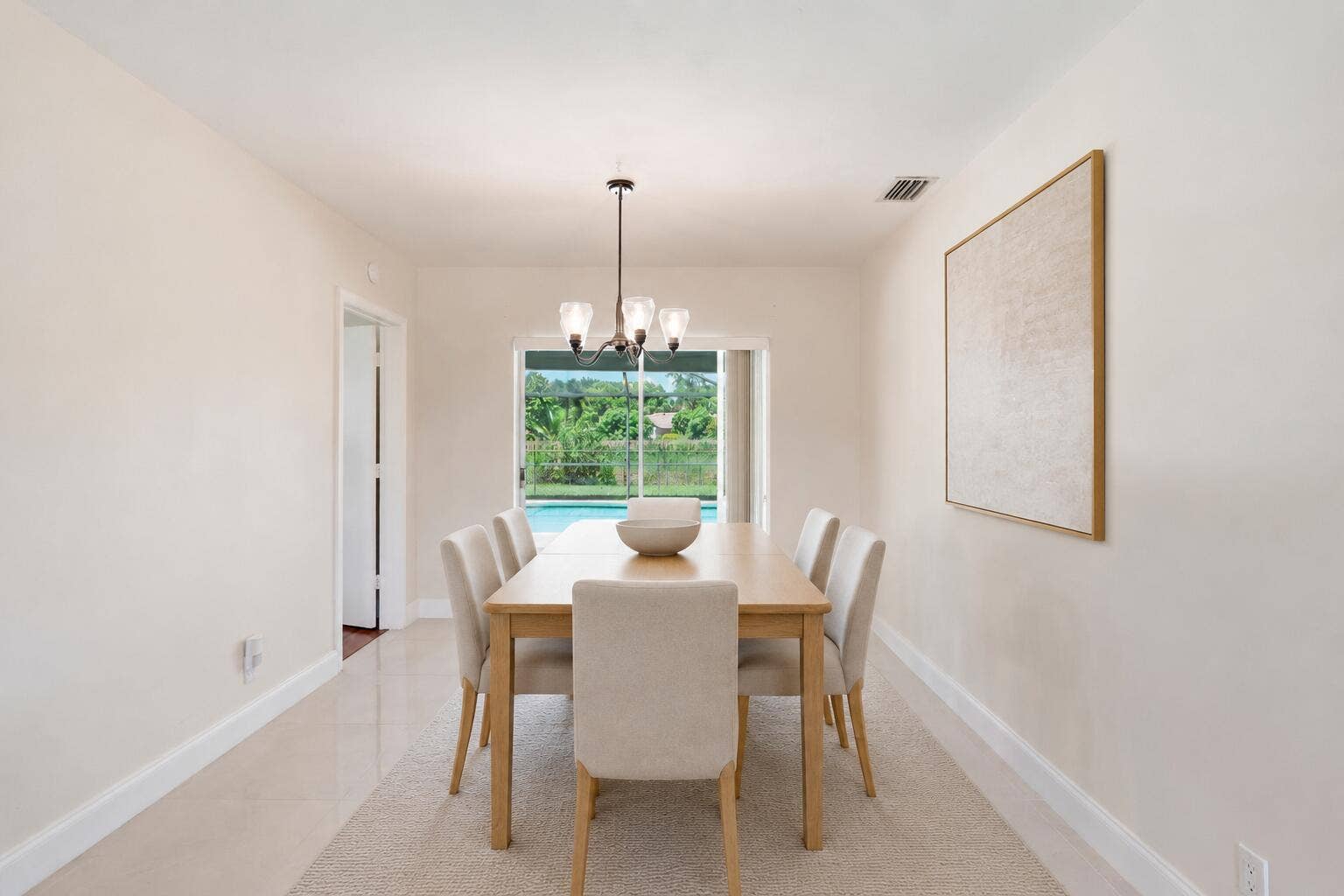115 Orchard Ridge Lane, Boca Raton, FL 33431 Dining Room with access to patio/pool. (virtually staged for illustrative purposes; no permanent features or finishes have been altered)