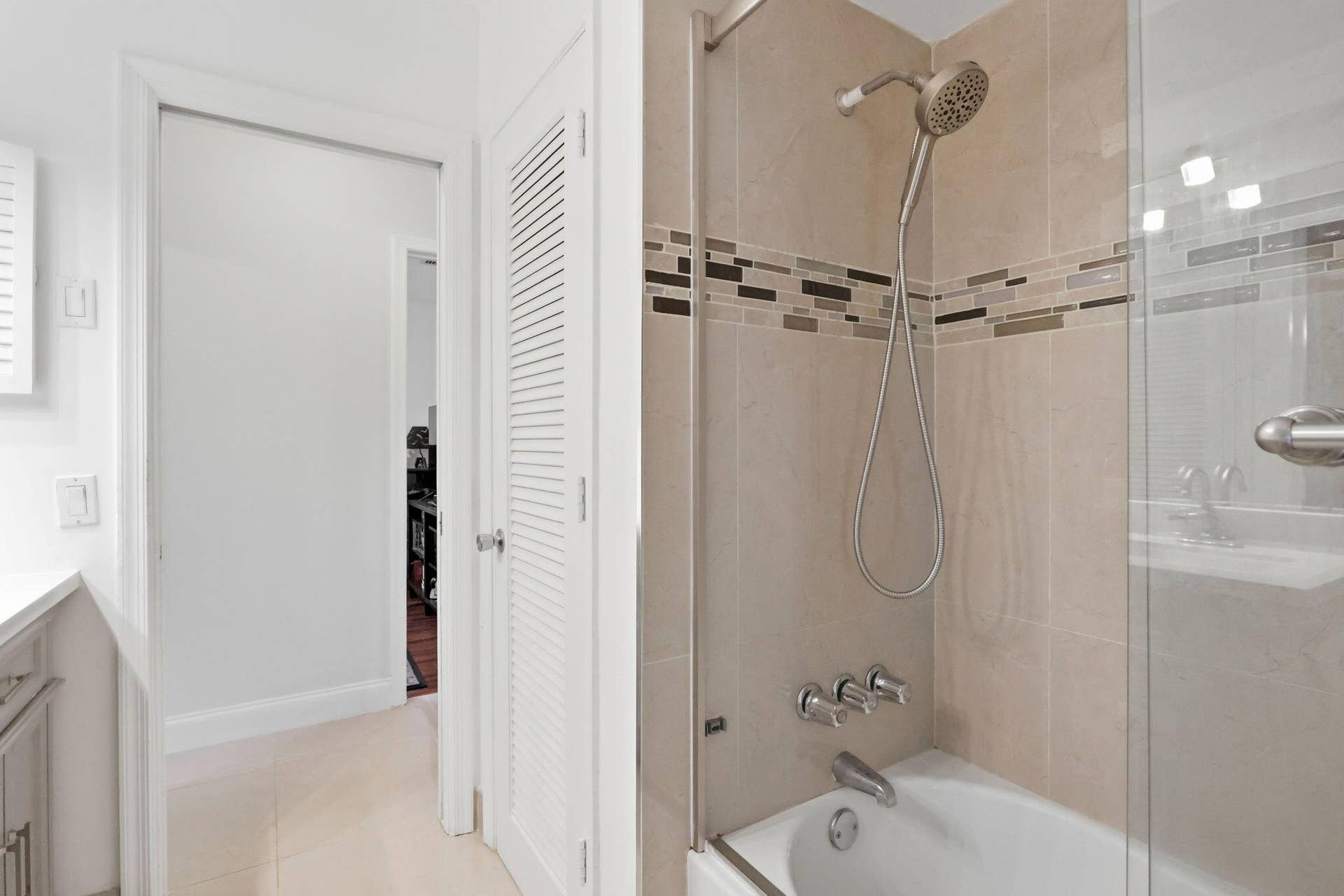 115 Orchard Ridge Lane, Boca Raton, FL 33431 cabana bathroom for bedrooms and guests. (virtually staged for illustrative purposes; no permanent features or finishes have been altered)